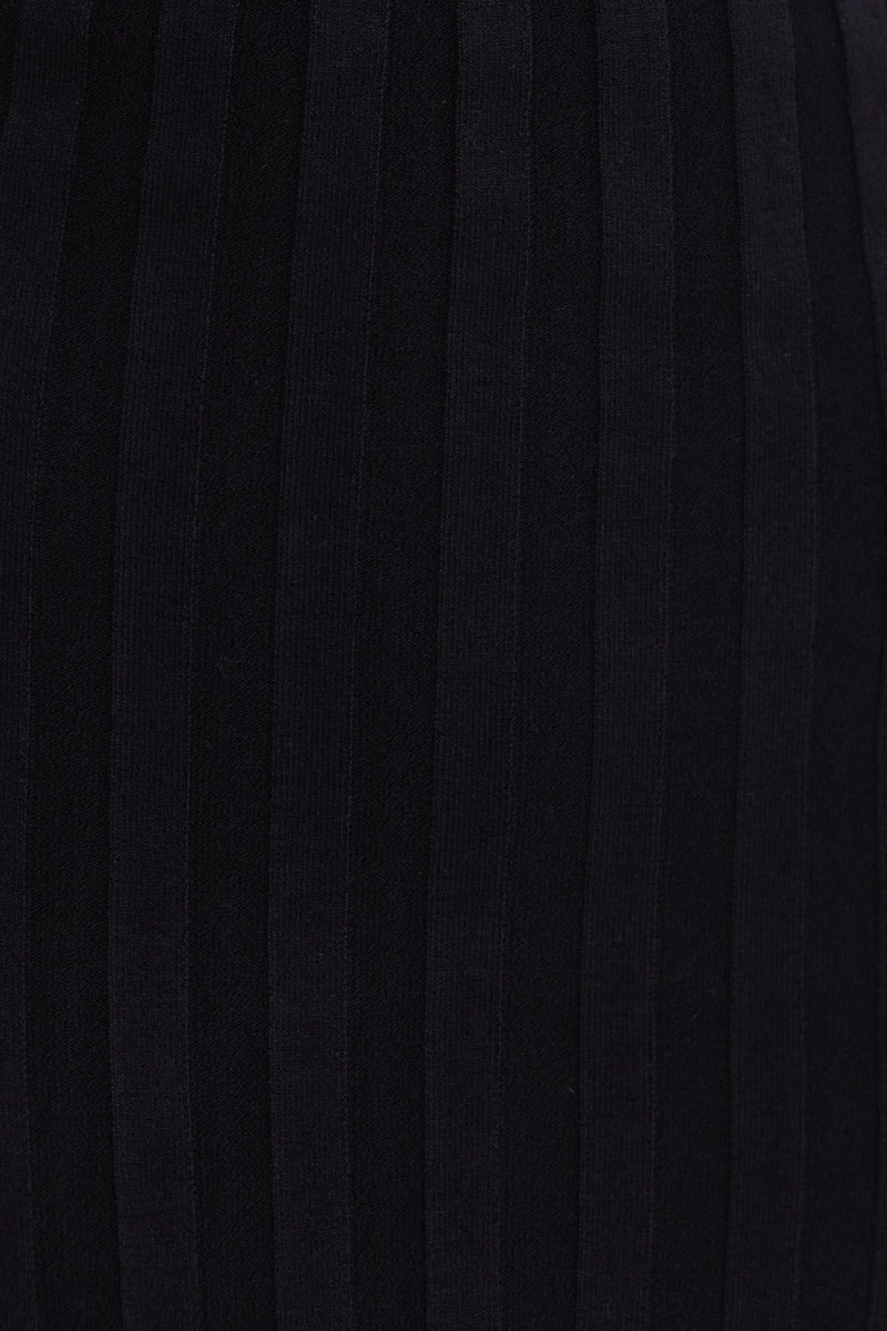 Close-up of black ribbed knit fabric showcasing vertical stripes for the Jordi Midi Dress.