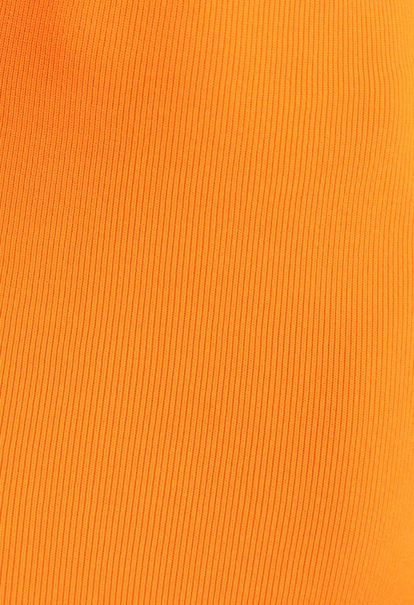 Close-up of ribbed orange fabric texture ideal for stylish midi dresses.