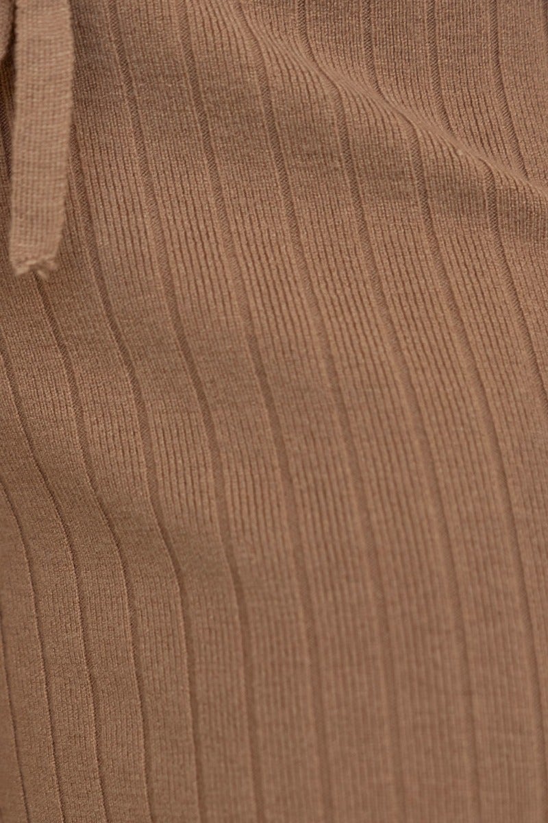 Close-up of the ribbed texture on Etta Pants in beige, featuring elastic waistband and adjustable drawstring.