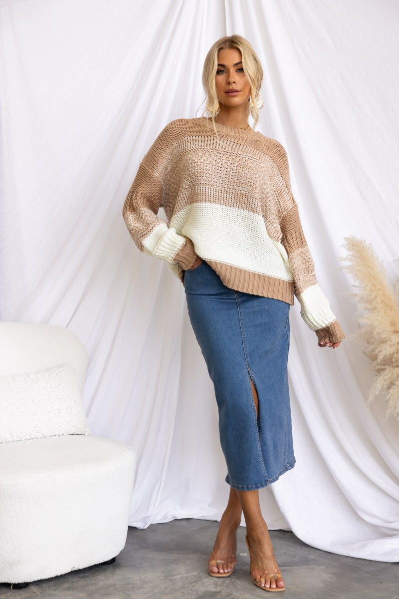 Casual relaxed fit Burma jumper with round neckline, worn with a denim skirt, styled for a chic look.