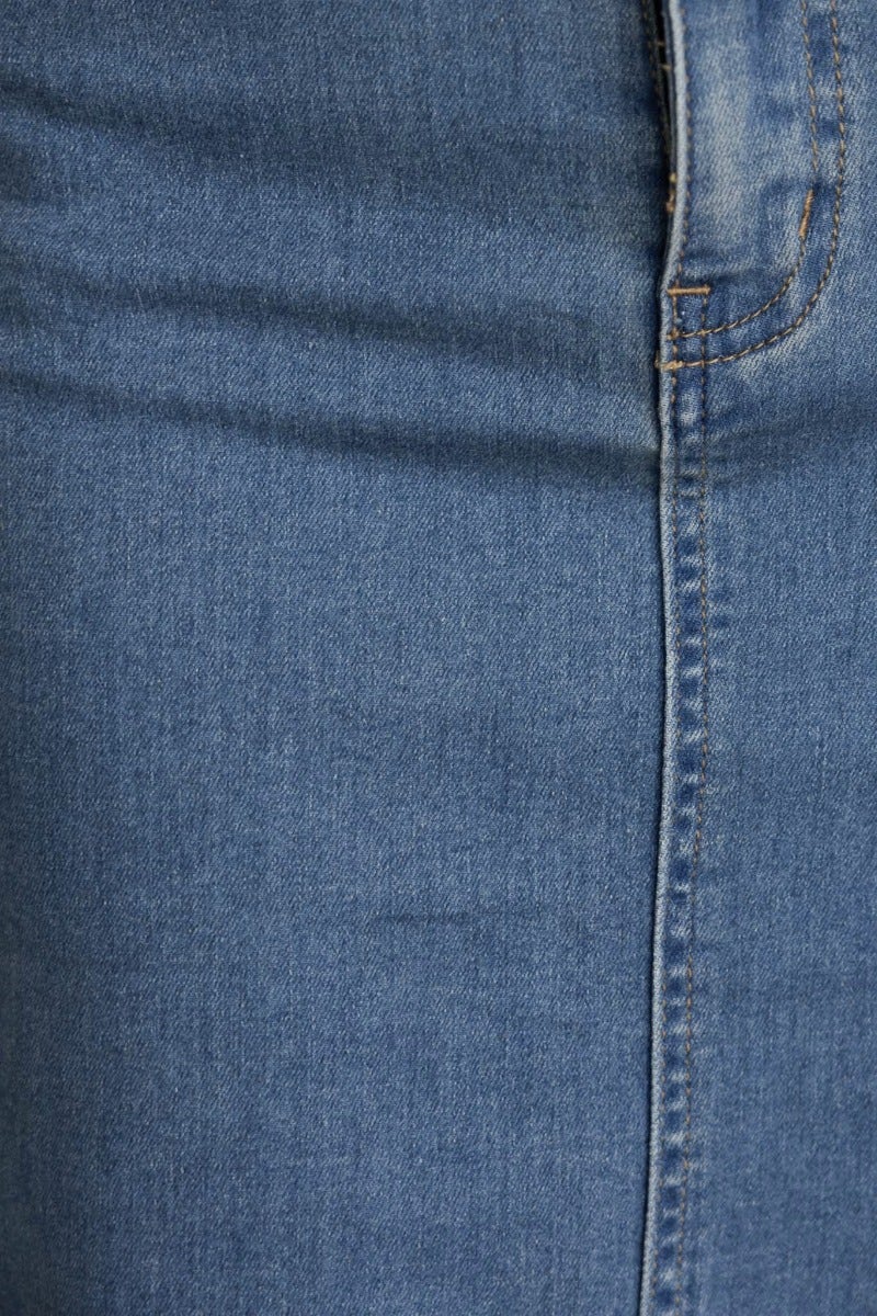 Close-up of the fabric texture and seam detail of the Evelyn Denim Midi Skirt, showcasing its high-quality denim material.