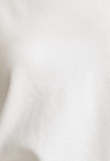 Close-up of the ribbed knit fabric of the Verny Jumper, showcasing its soft texture and stretch material.