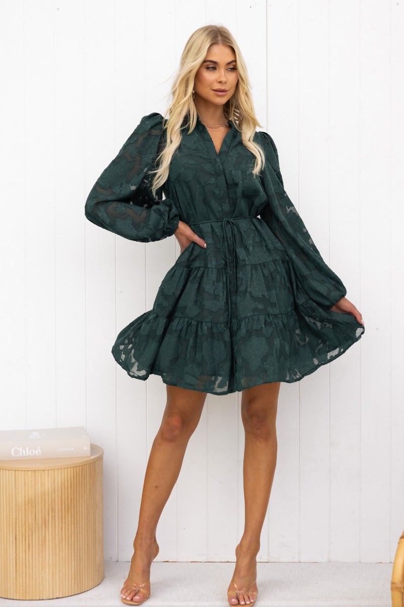 Halston embossed print dress in green with button-up front and elastic sleeves, styled elegantly by a model.
