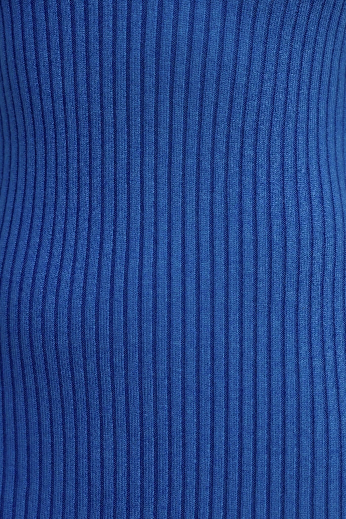 Close-up of ribbed knit material in vibrant blue, showcasing texture and stretch for the Dosa Midi Dress.