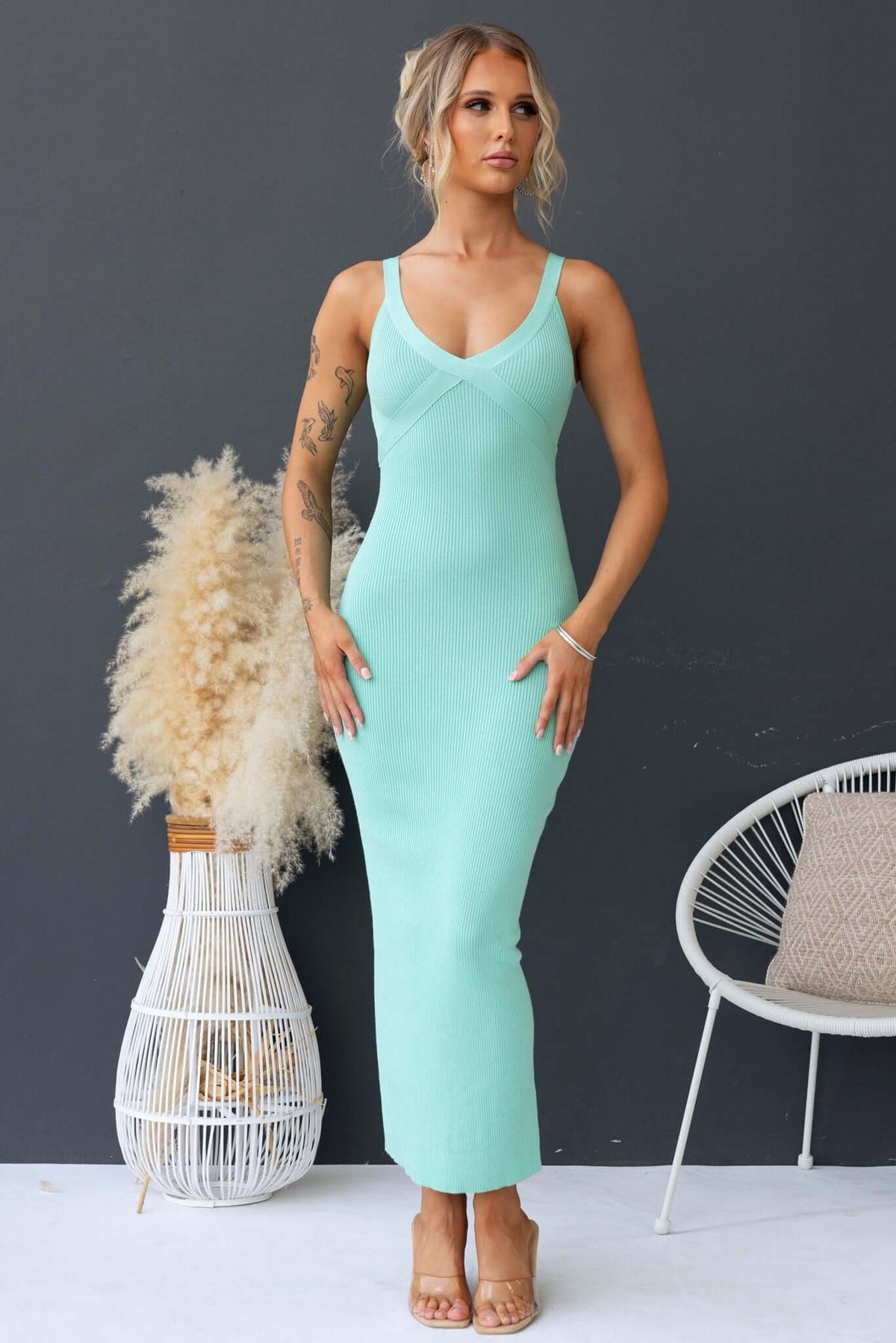 Calluna Maxi Dress in mint green, featuring a V-neckline and ribbed knit material, styled for spring-summer fashion.