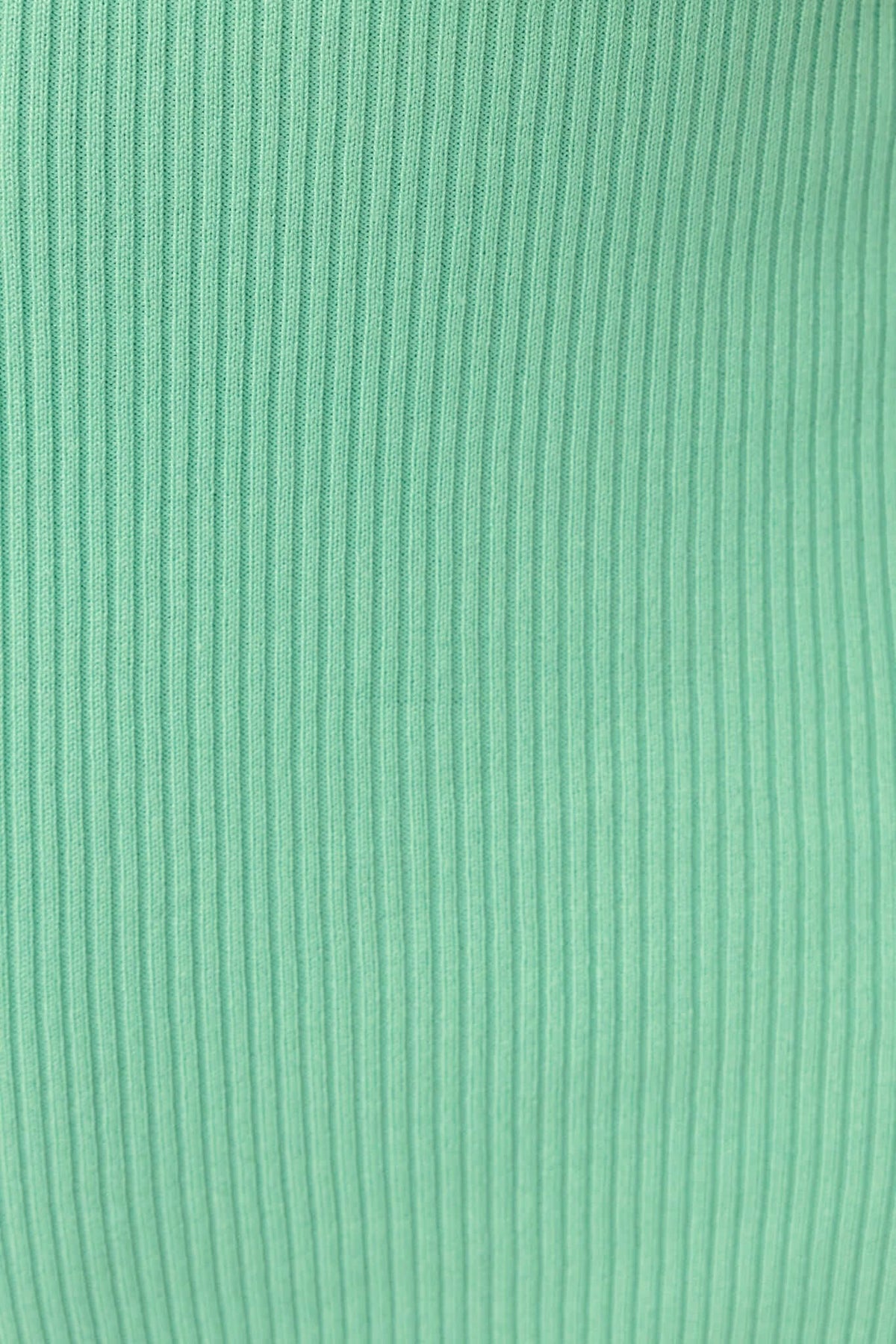 Close-up of ribbed knit fabric in mint green, highlighting texture for Calluna Maxi Dress.