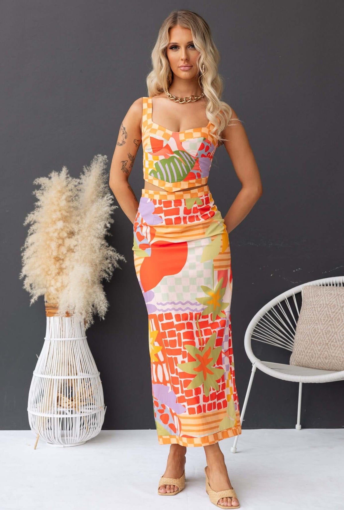 Paltrow Set featuring colorful floral print, adjustable straps, and a stylish maxi skirt for chic summer fashion.