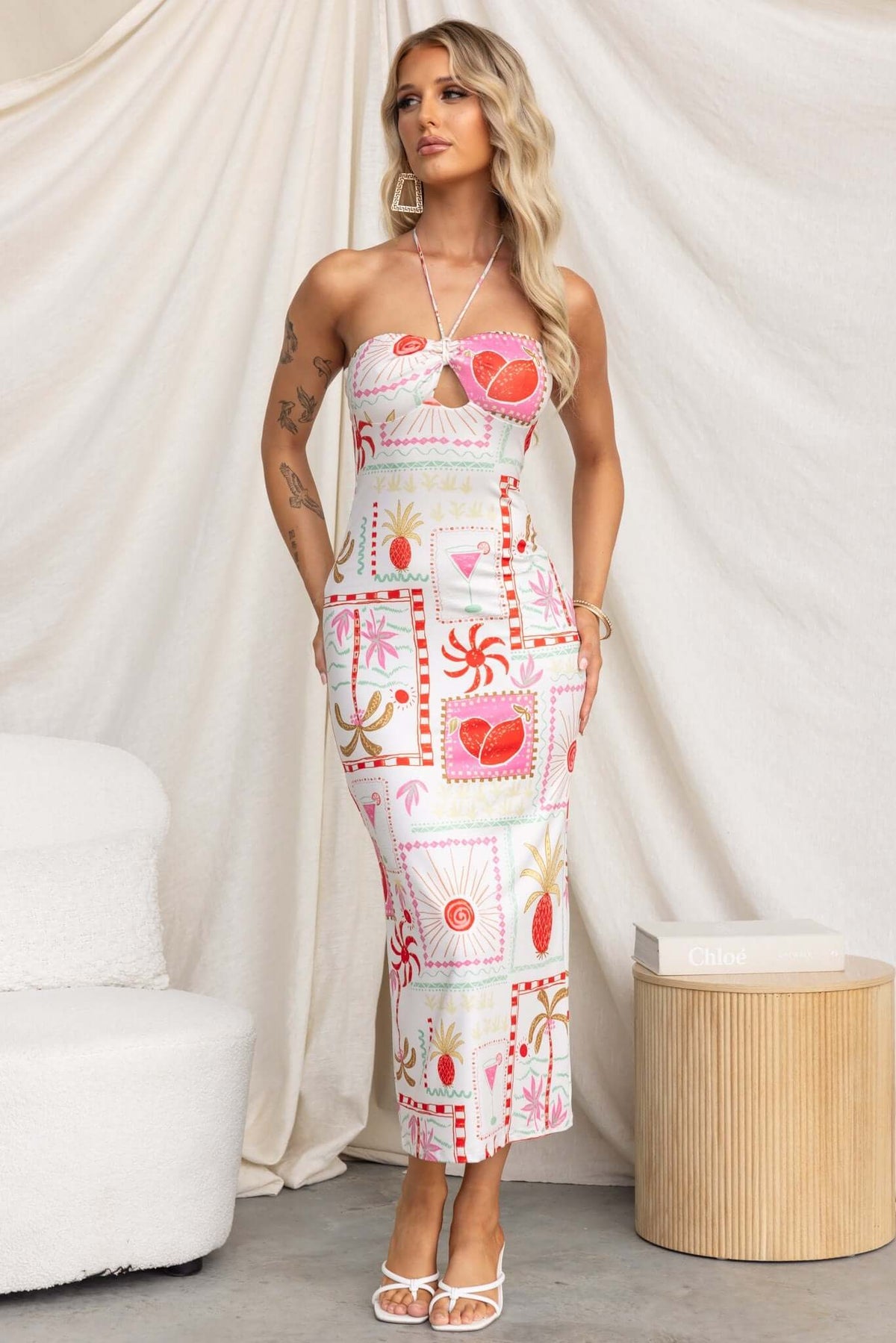 Strapless Carianne Midi Dress featuring vibrant patterns, anti-slip design, and a tie neckline.
