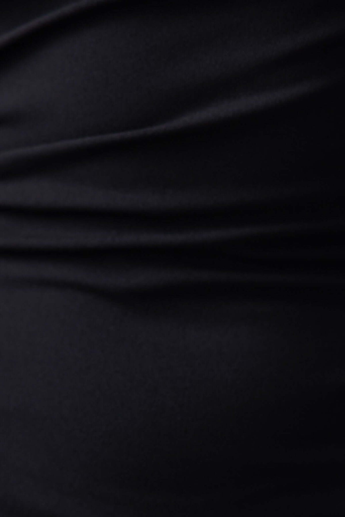 Close-up of black fabric texture showcasing soft, stretch material from the Jarina Maxi Dress.