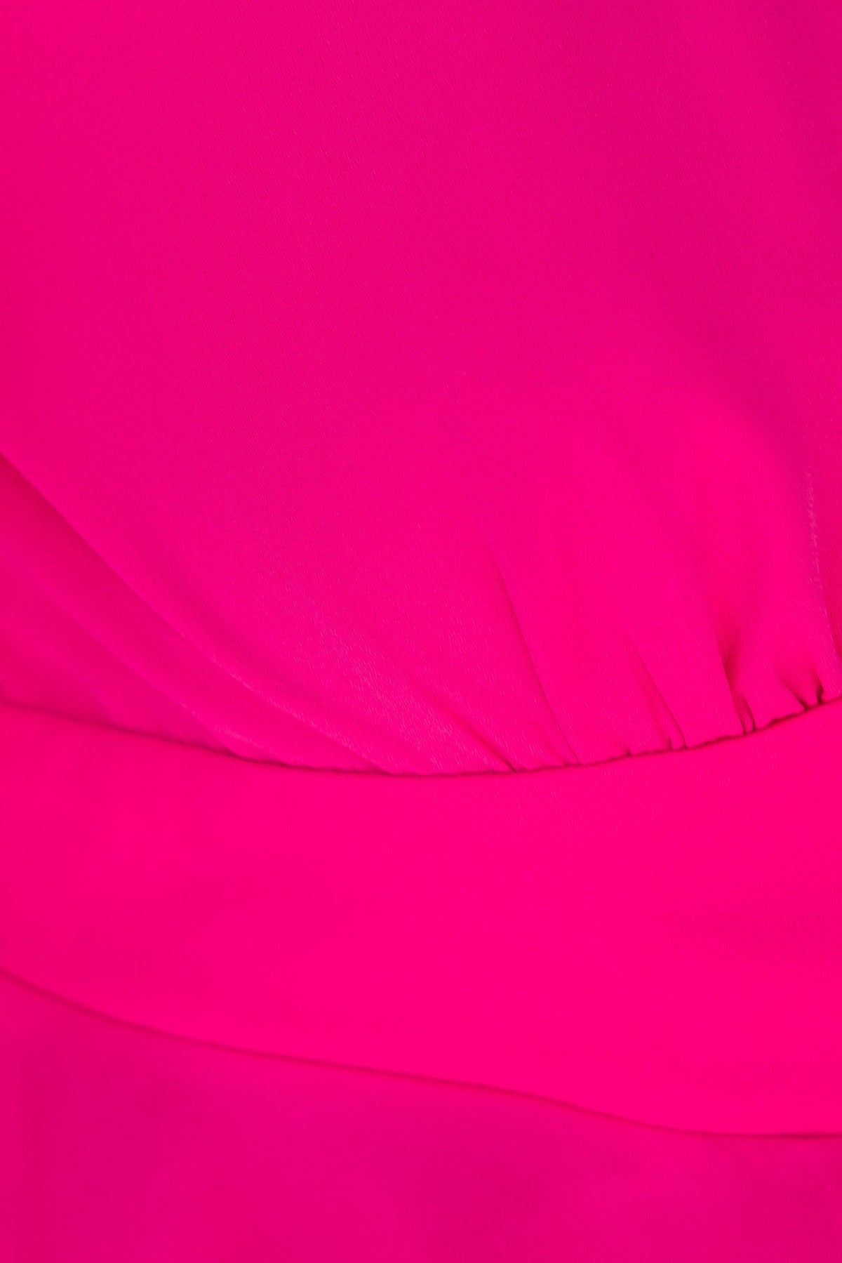 Close-up of bright pink chiffon fabric showcasing gathered detail of Fleur Top.