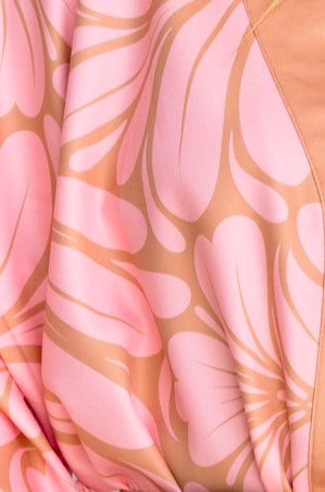 Close-up of pink floral fabric pattern featuring smooth, lightweight material for stylish Raddix Pants.