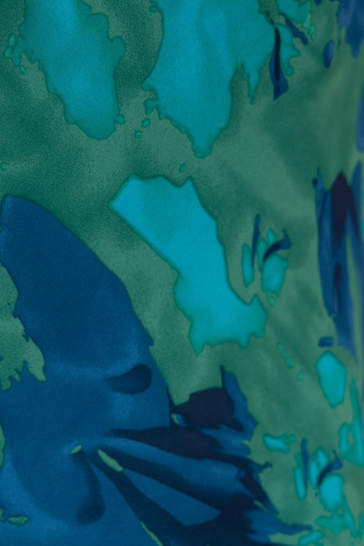 Close-up of vibrant floral print on Freyda Maxi Dress in shades of blue and green.