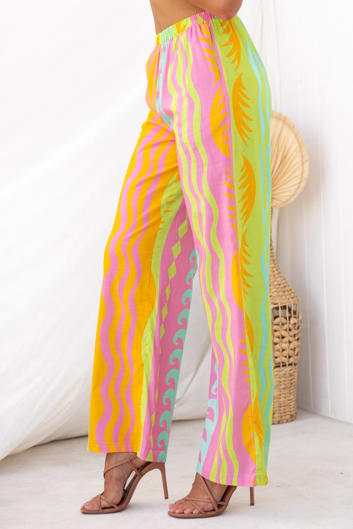 Colorful Verney Pants featuring a mid-high waist fit, elastic waistband, and vibrant abstract patterns.