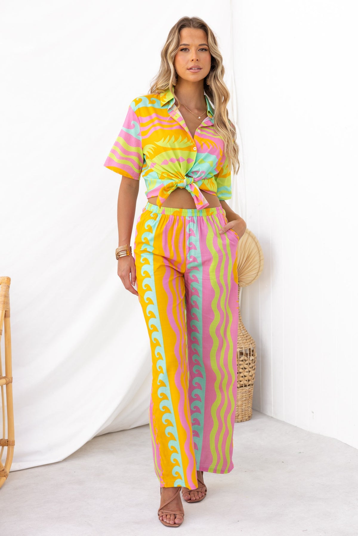 Model wearing colorful Verney Pants with a matching cropped top, showcasing a stylish and vibrant summer look.