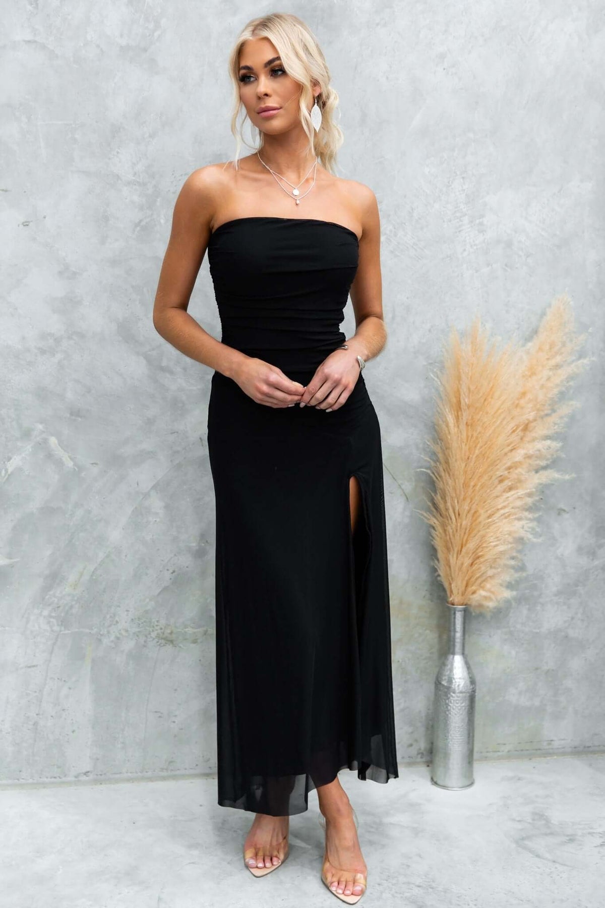 Legrand Maxi Dress: Strapless black maxi dress with front split, lined and fitted design, perfect for any occasion.