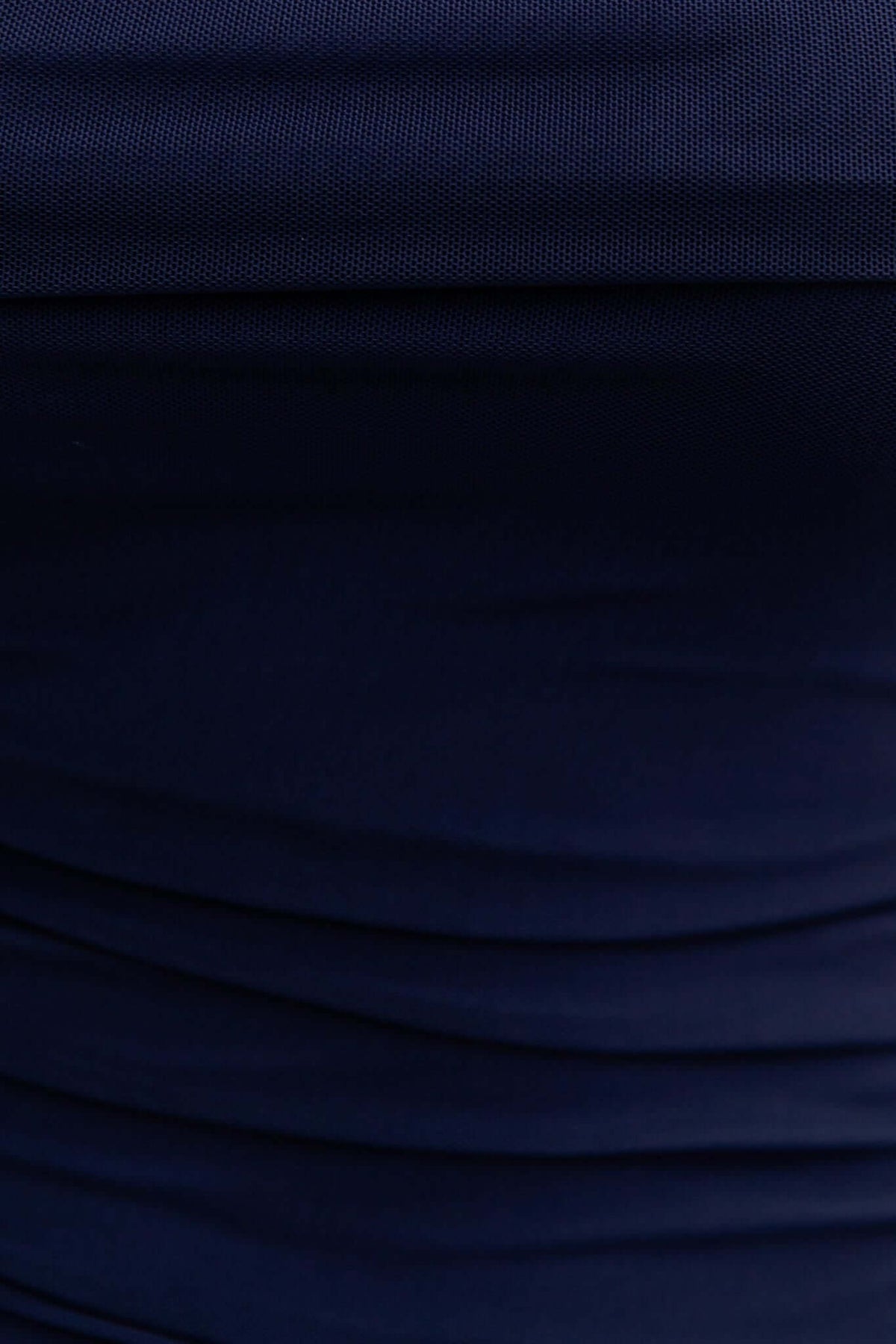 Close-up of navy fabric of Legrand Maxi Dress showcasing its stretch and ruched details.