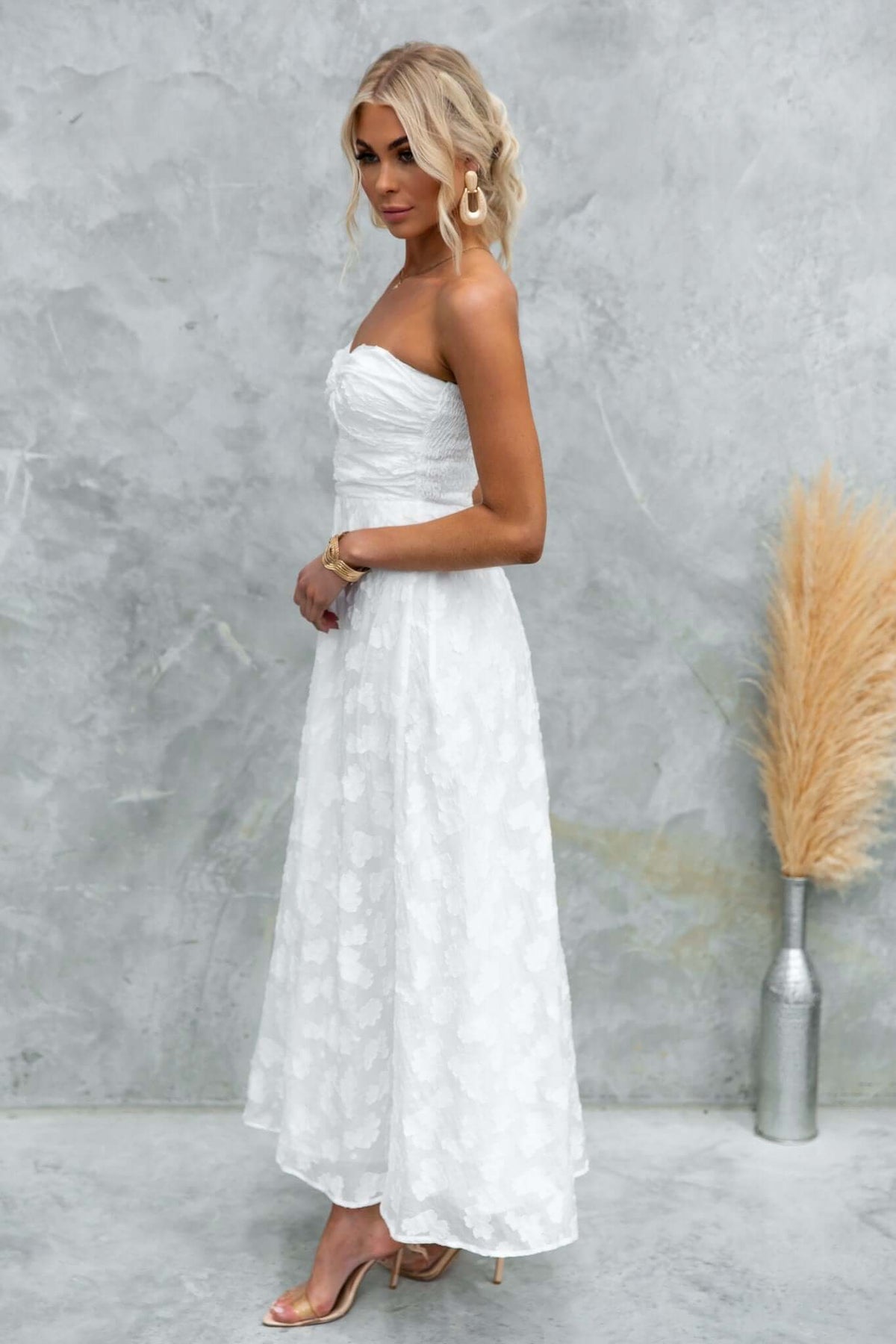 Ivrea Maxi Dress in white, strapless design with elastic back and invisible zip, styled for a chic look.