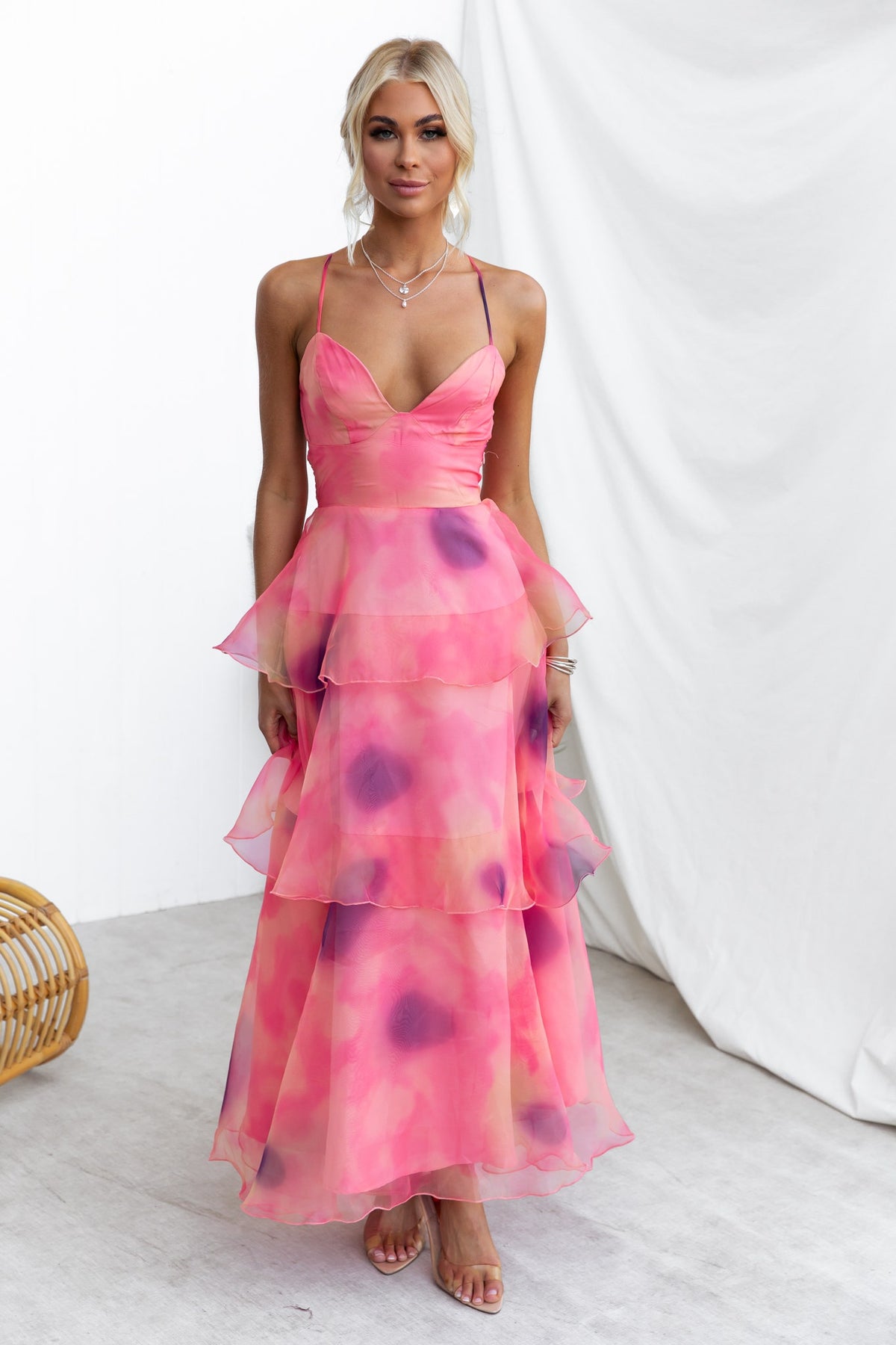 Elinor Maxi Dress in pink with ruffle tiers, adjustable straps, and chiffon material, perfect for summer occasions.