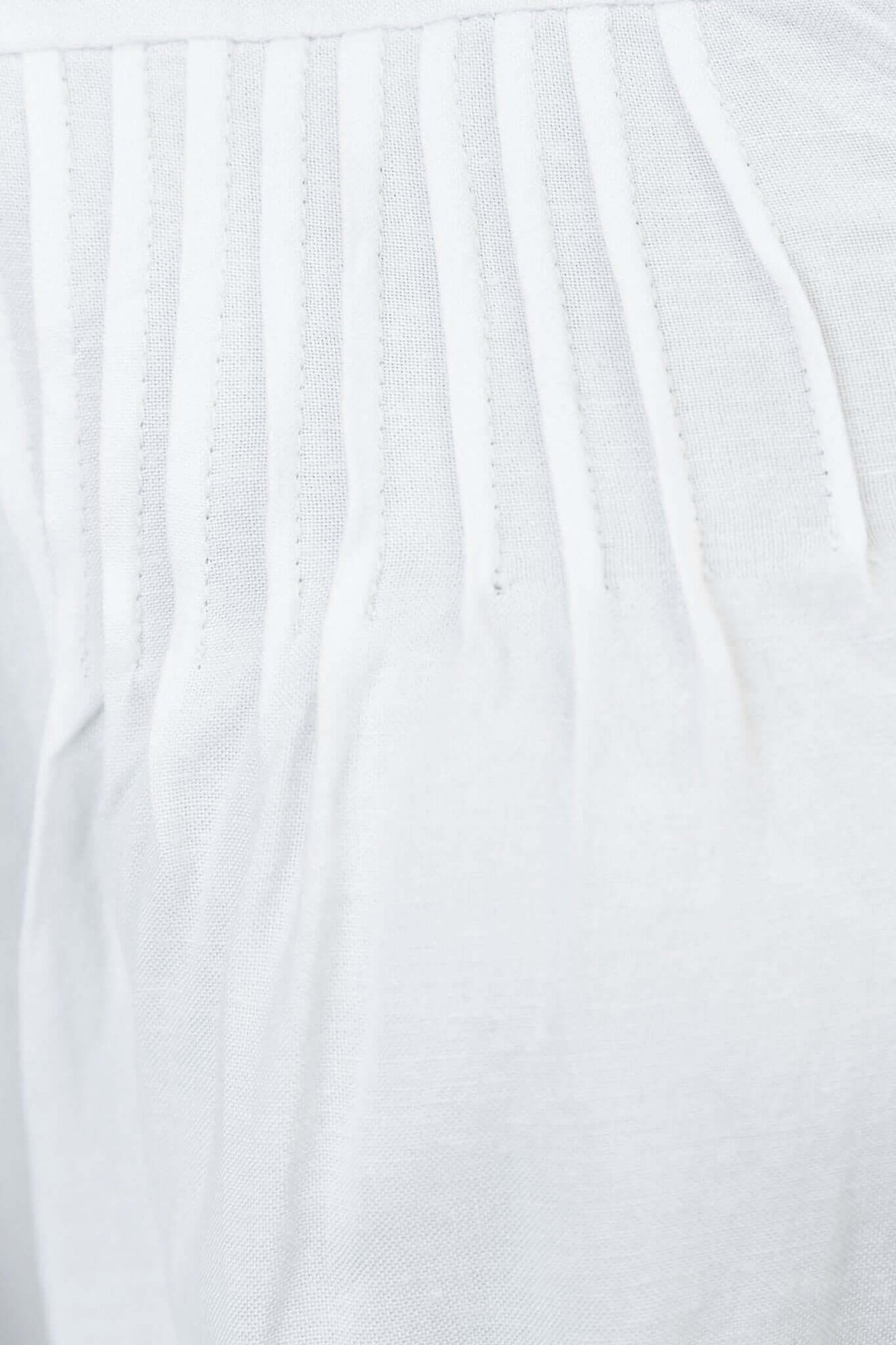 Close-up of the fabric texture and detailing of the Brunie Shirt, showcasing its linen-inspired look.