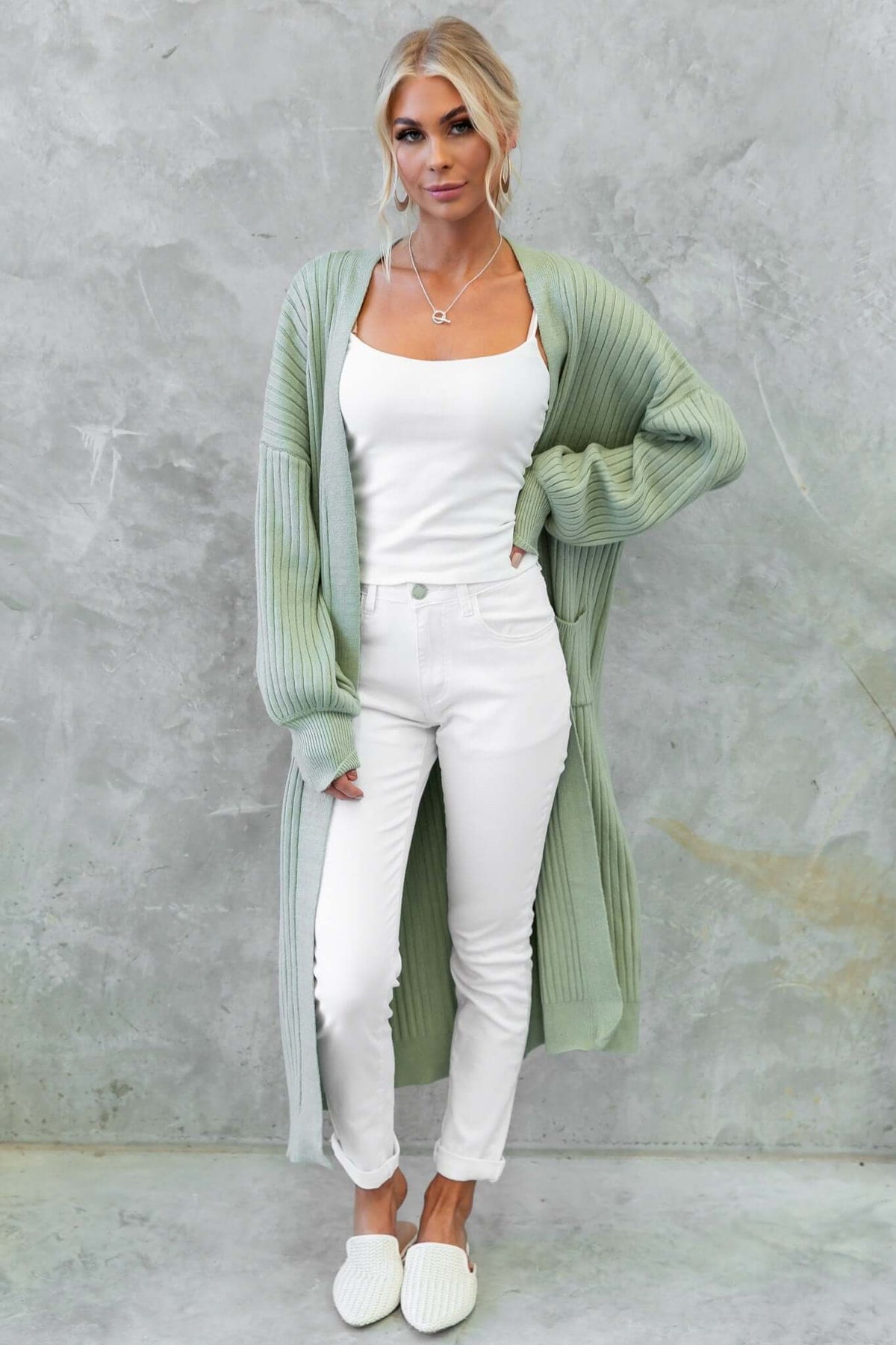 Fano Cardigan in sage green, styled with a white tank and skinny jeans for a casual, chic look.