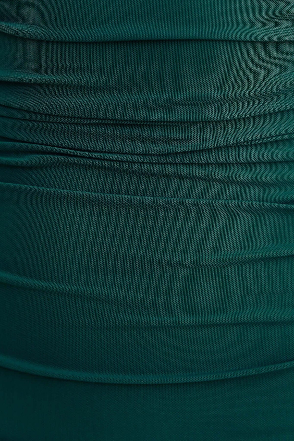 Close-up of ruching detail on Kato Midi Dress in rich green mesh fabric, showcasing elegant texture and style.