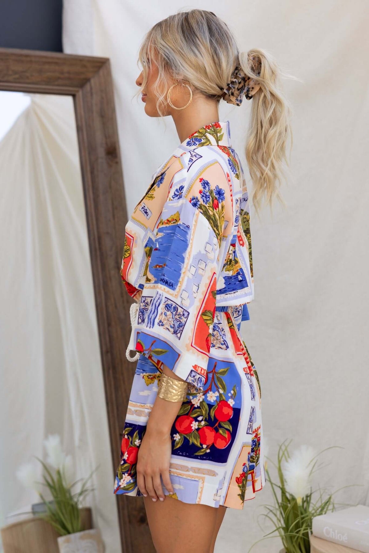 Stylish Fiddler Playsuit featuring a colorful design, short sleeves, and a relaxed fit, worn by a model.