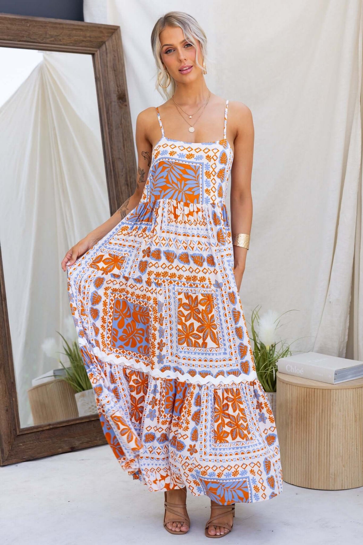 Dapple Maxi Dress featuring an elegant print, adjustable straps, and a relaxed fit, perfect for summer outings.
