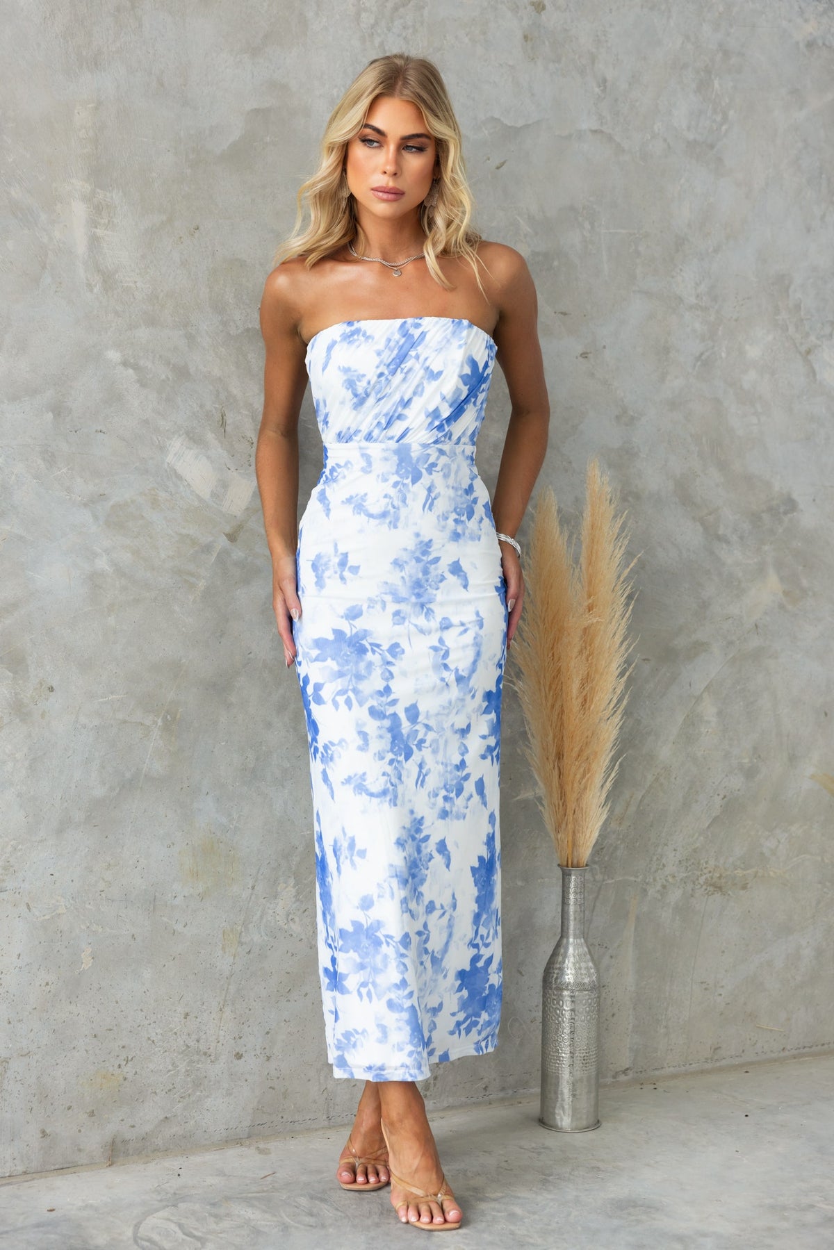 Strapless floral print Katia maxi dress in blue, lined with anti-slip bust and mesh overlay, showcased against a neutral background.