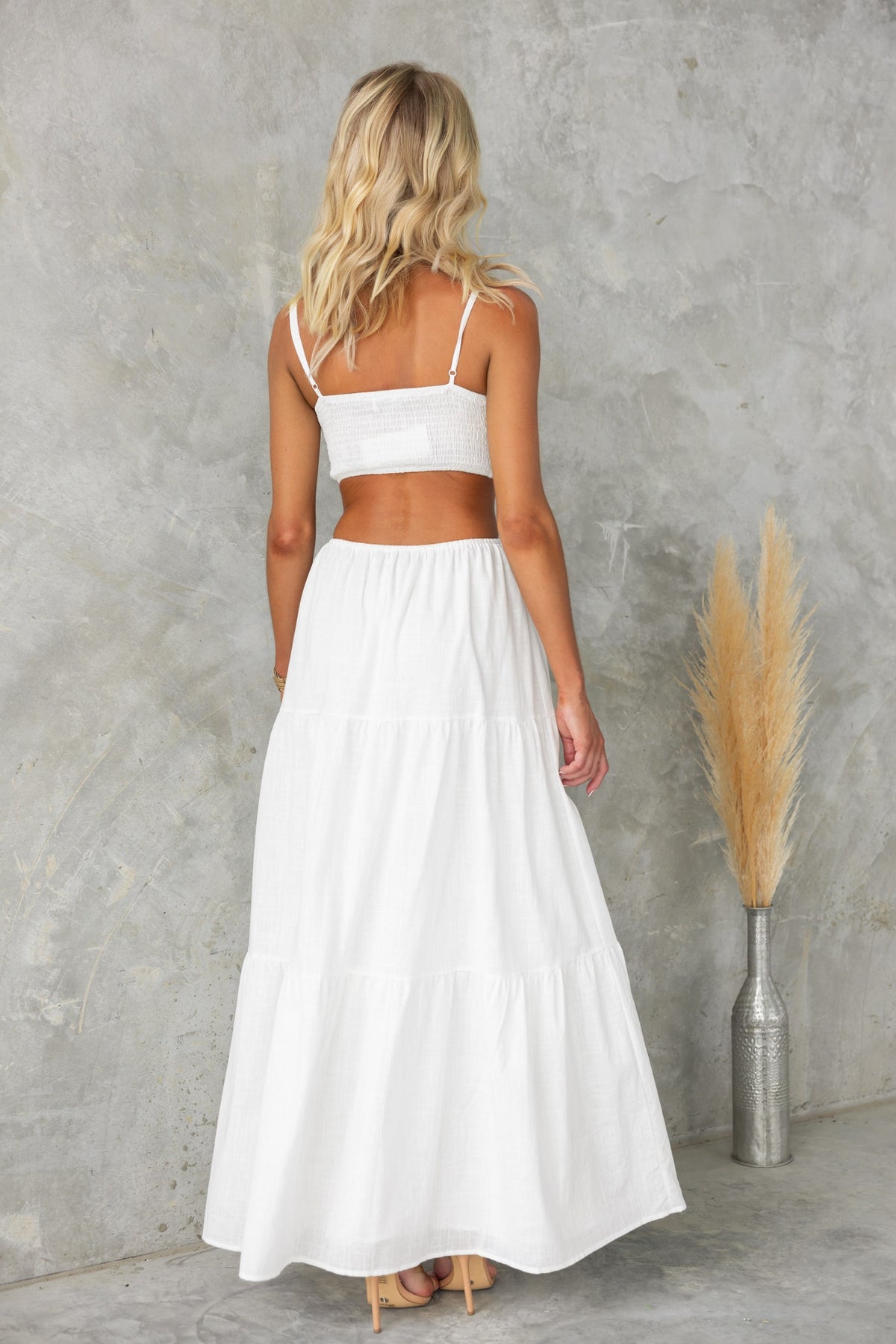 Back view of Noya Maxi Dress featuring adjustable straps and a tiered design, perfect for summer occasions.