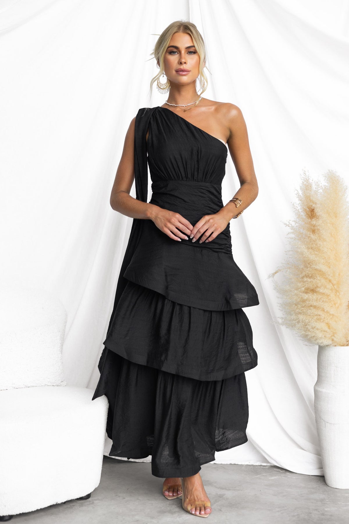 Elegant black Bentley Maxi Dress with one-shoulder neckline and ruffle hem, perfect for stylish occasions.