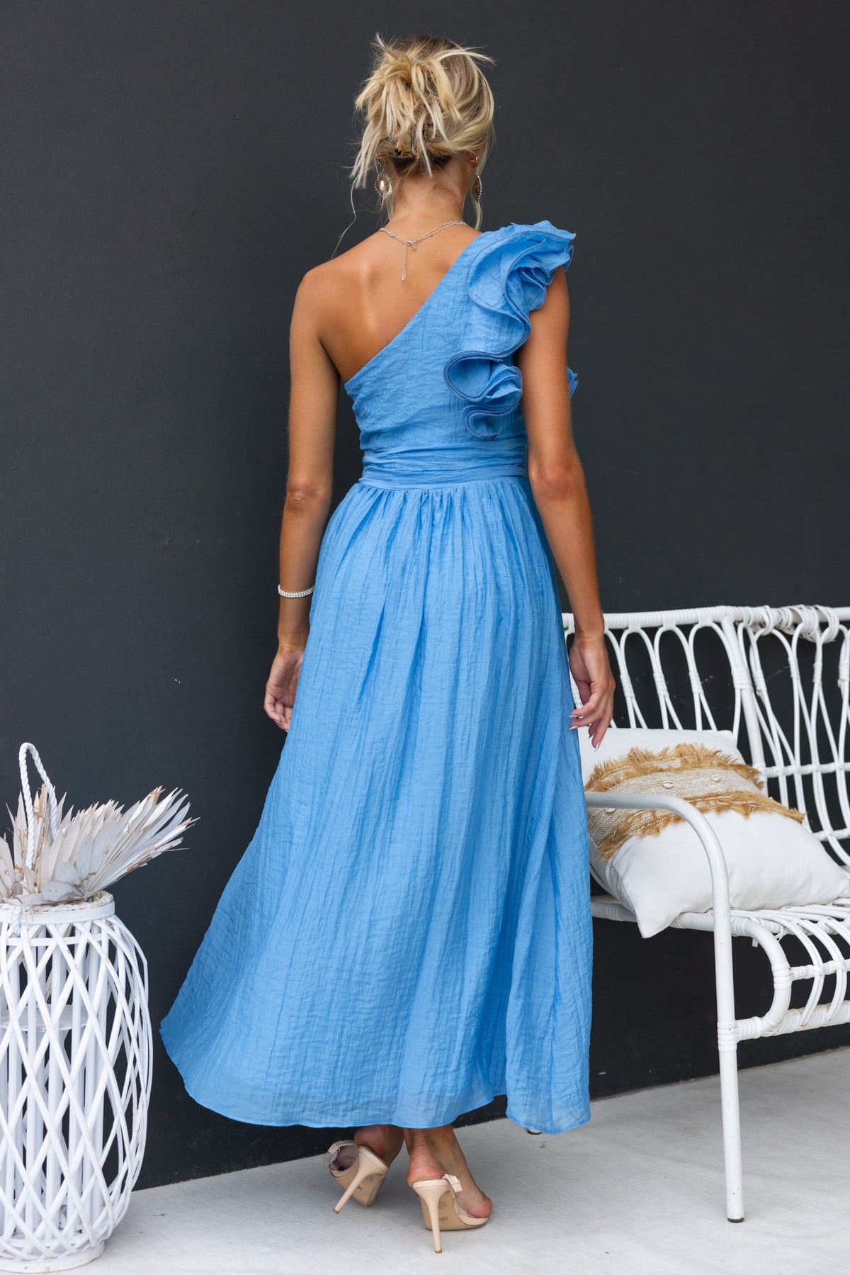 Etsa Maxi Dress in blue, one-shoulder style with ruffle, perfect for summer occasions, shown from behind.
