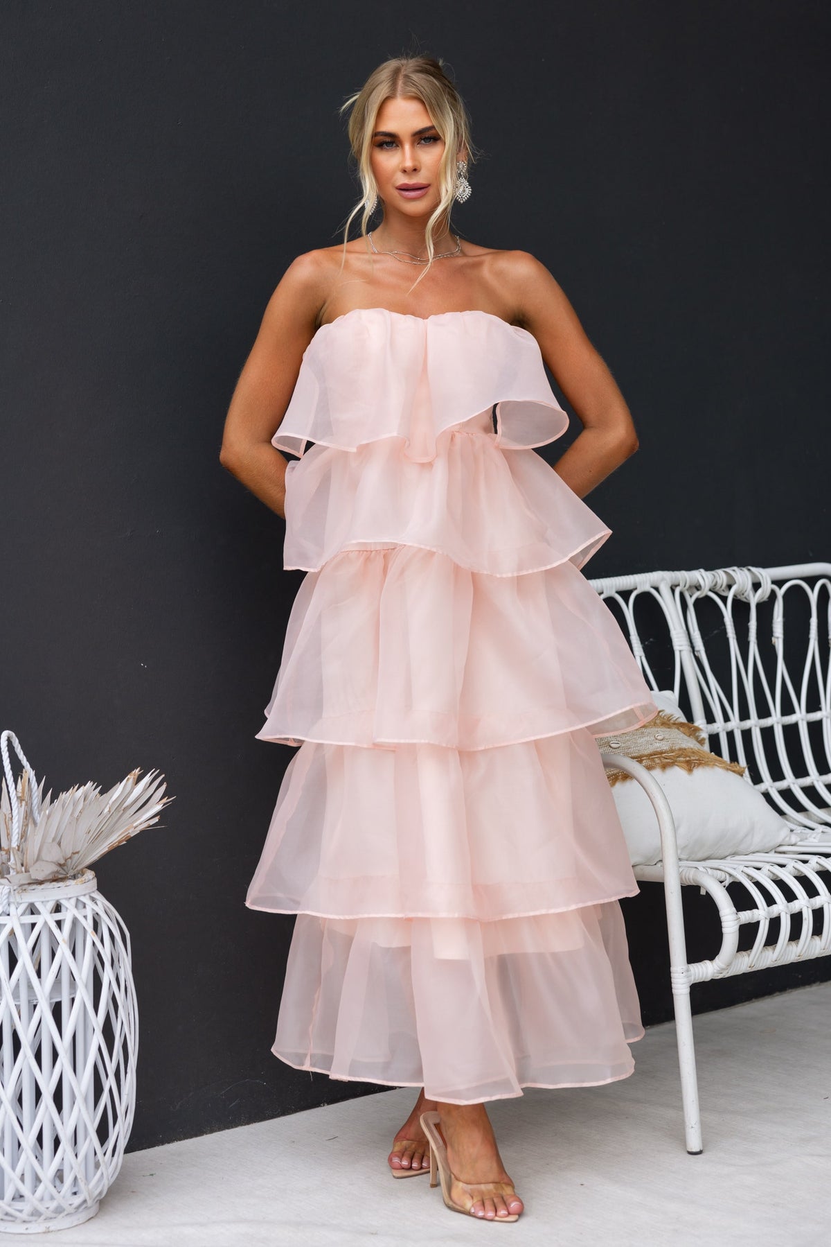 Lilianna Maxi Dress in soft peach with layered chiffon design, strapless style, perfect for warm weather occasions.
