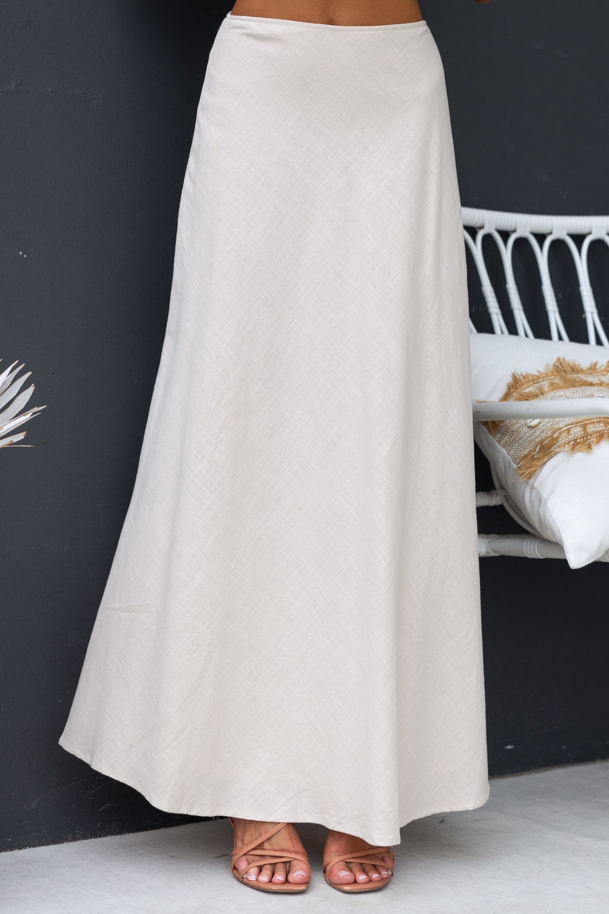 Shana Maxi Skirt in light beige, featuring a mid-high waist and flowing design, perfect for casual or dressy occasions.