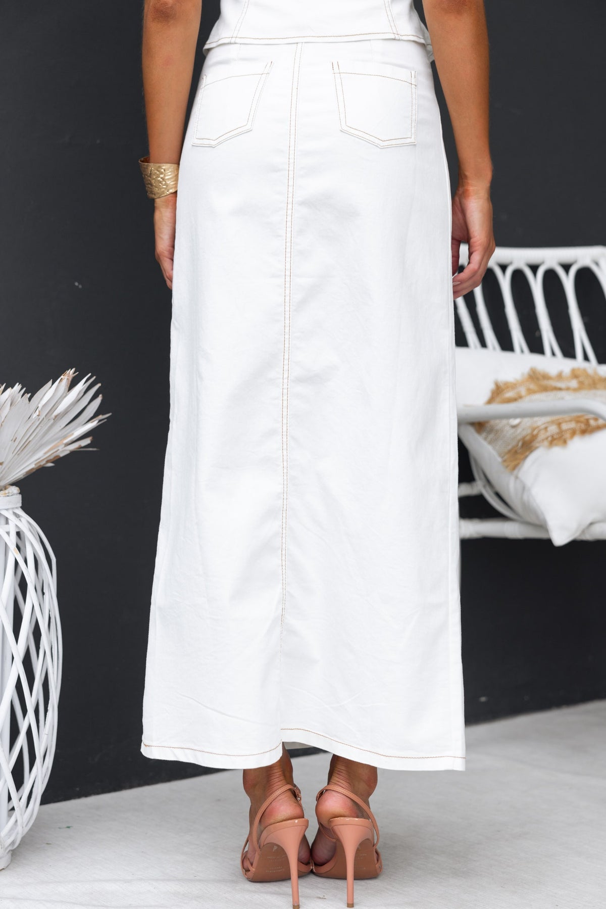 Back view of Jayson Denim Maxi Skirt featuring mid-high waist, pockets, and a stylish long fit. Perfect for versatile outfits.