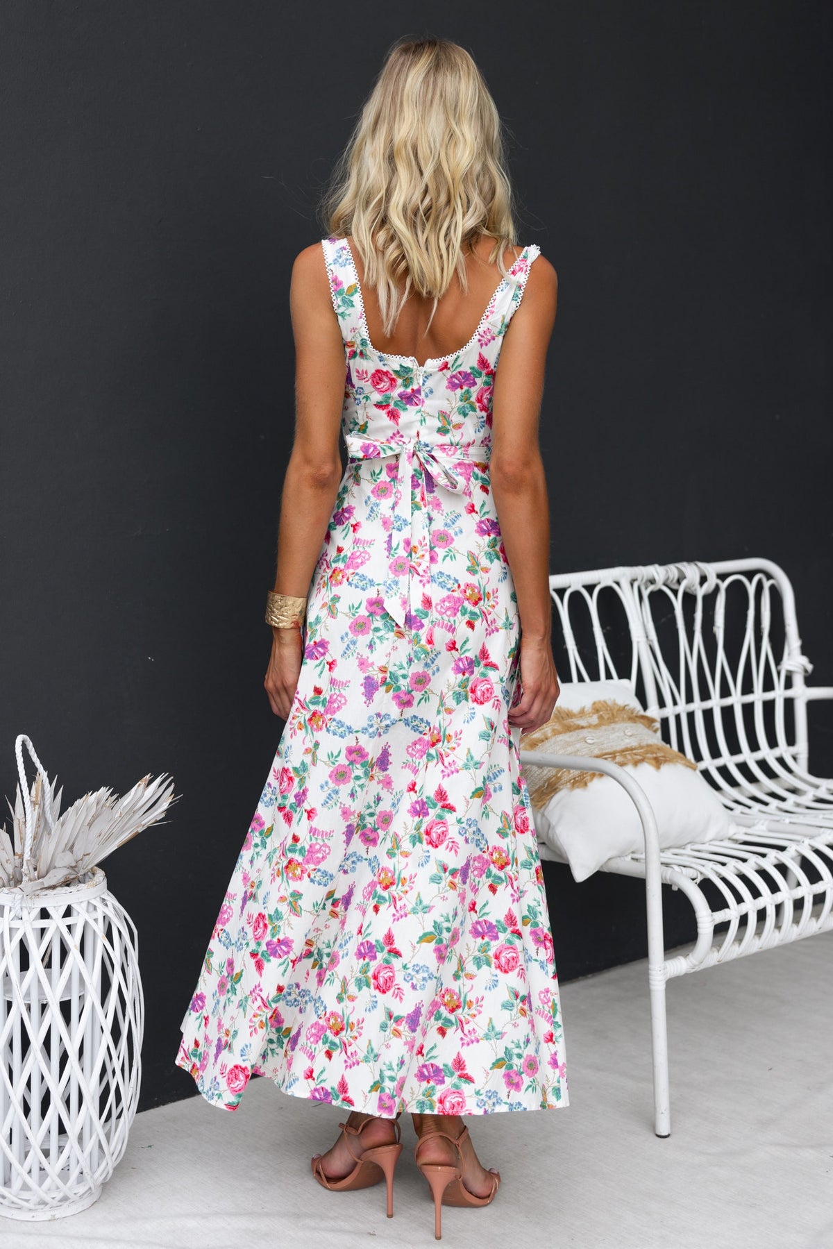 Back view of Keely Midi Dress with floral print, fabric tie, and flared hem. Perfect for casual outings and events.