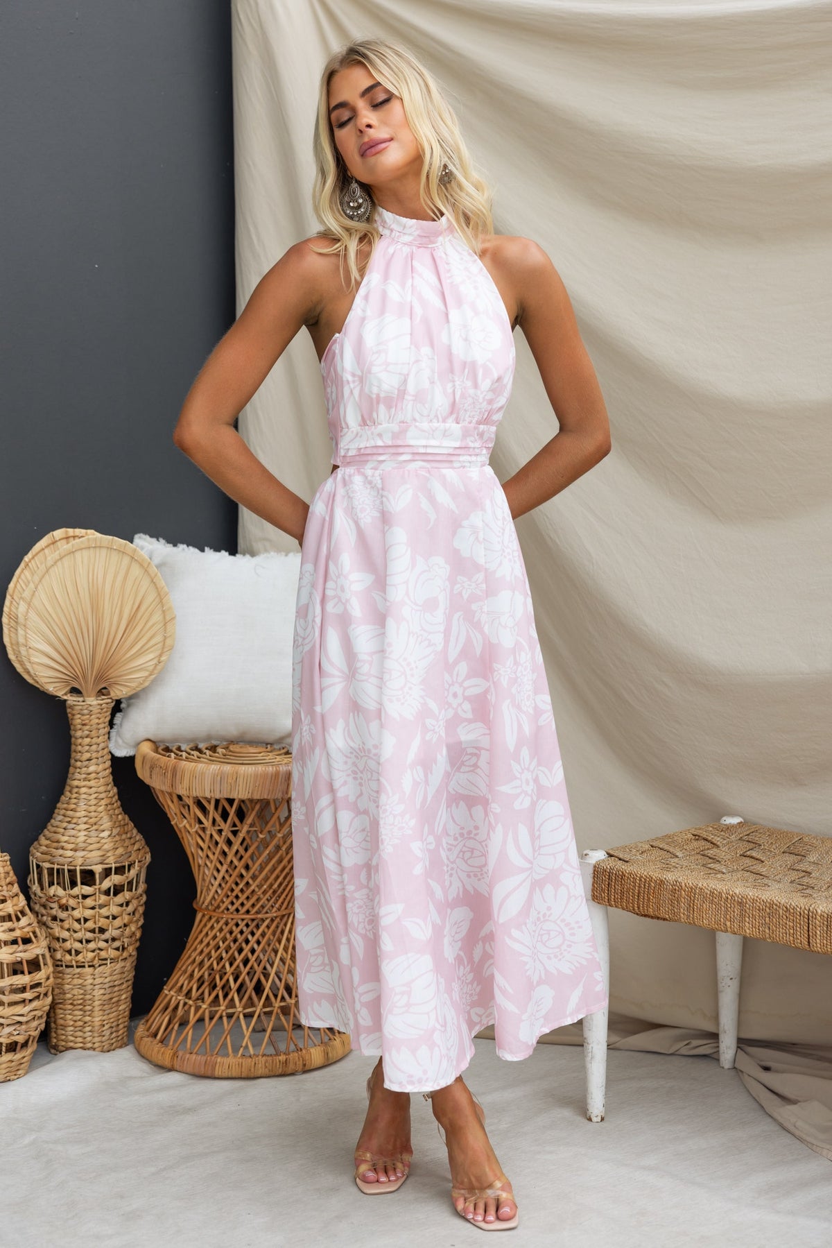 Corio Midi Dress in pink floral print, featuring halter neckline and tie back, perfect for summer occasions.