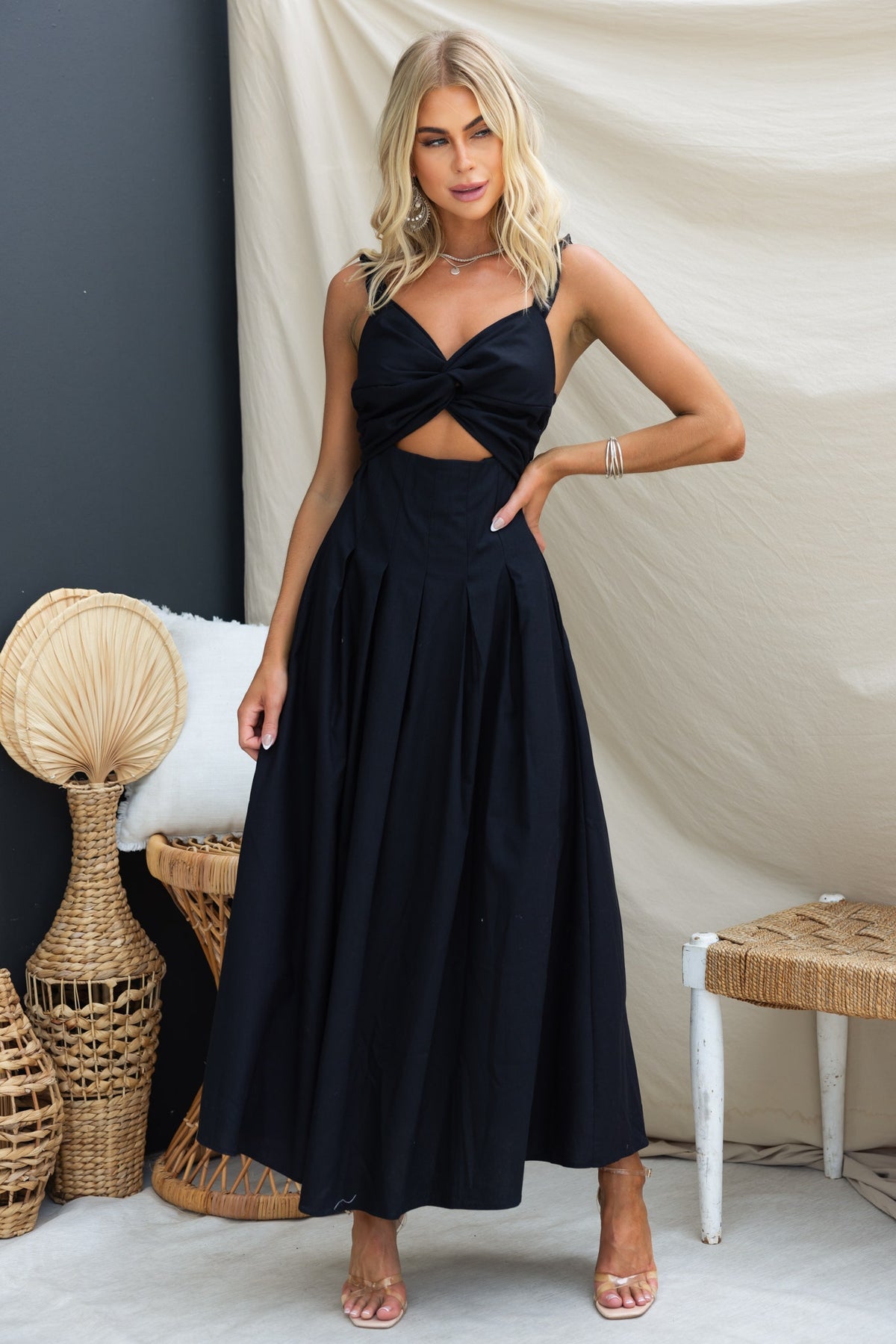 Elegant black linen blend Nerida maxi dress with twist detail and pleats, perfect for any occasion.