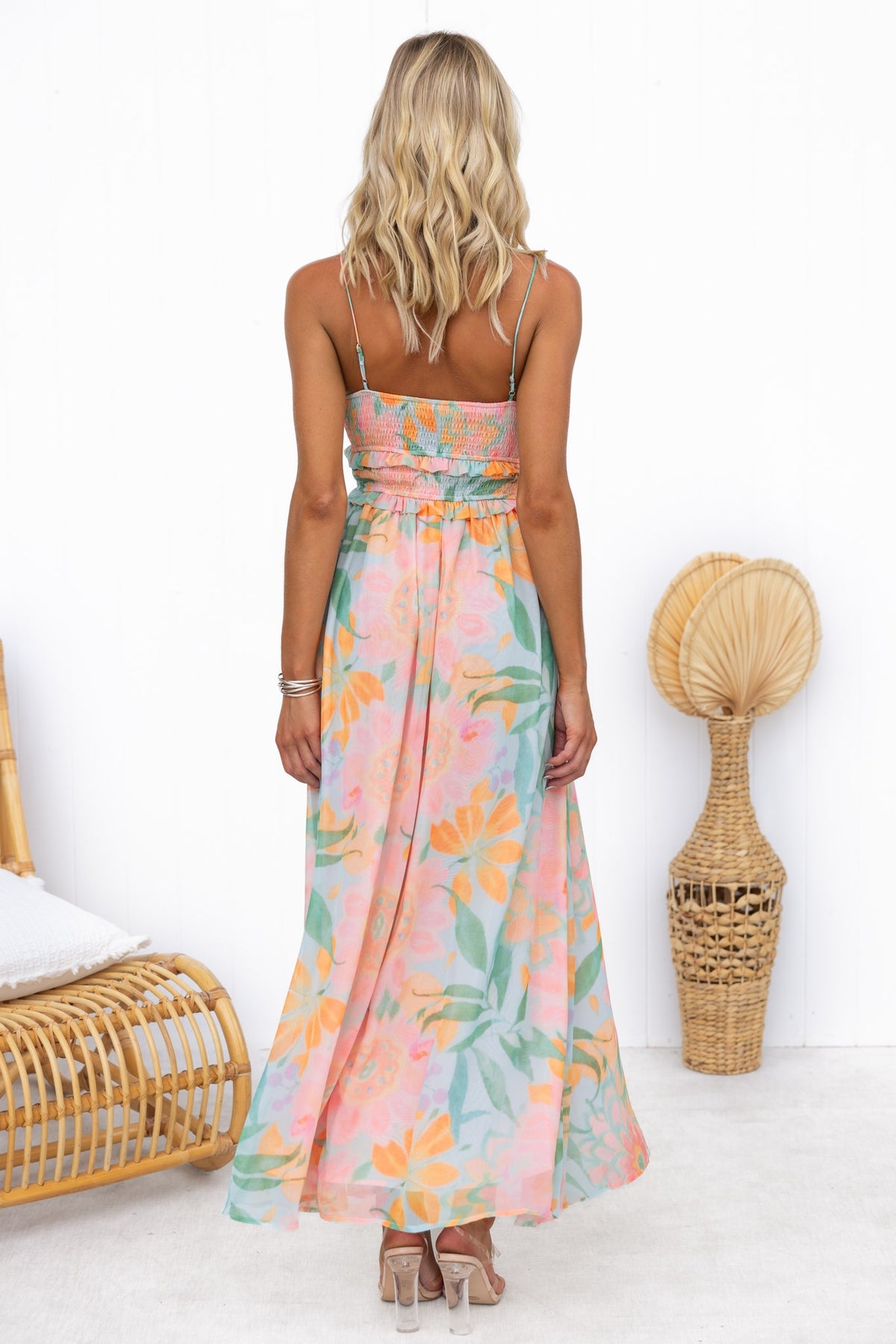 Back view of Alara Maxi Dress featuring adjustable straps and floral print, perfect for summer occasions.