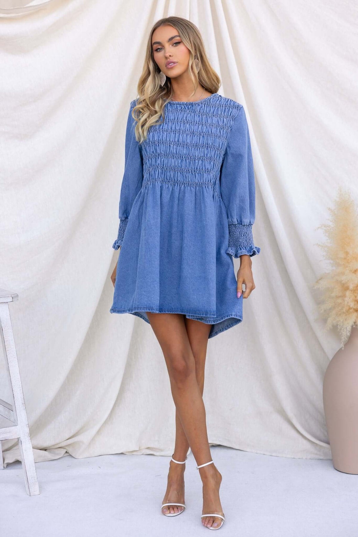 Model wearing the Tulsa Denim Dress with elastic bust and sleeves, featuring a relaxed fit and zip back.