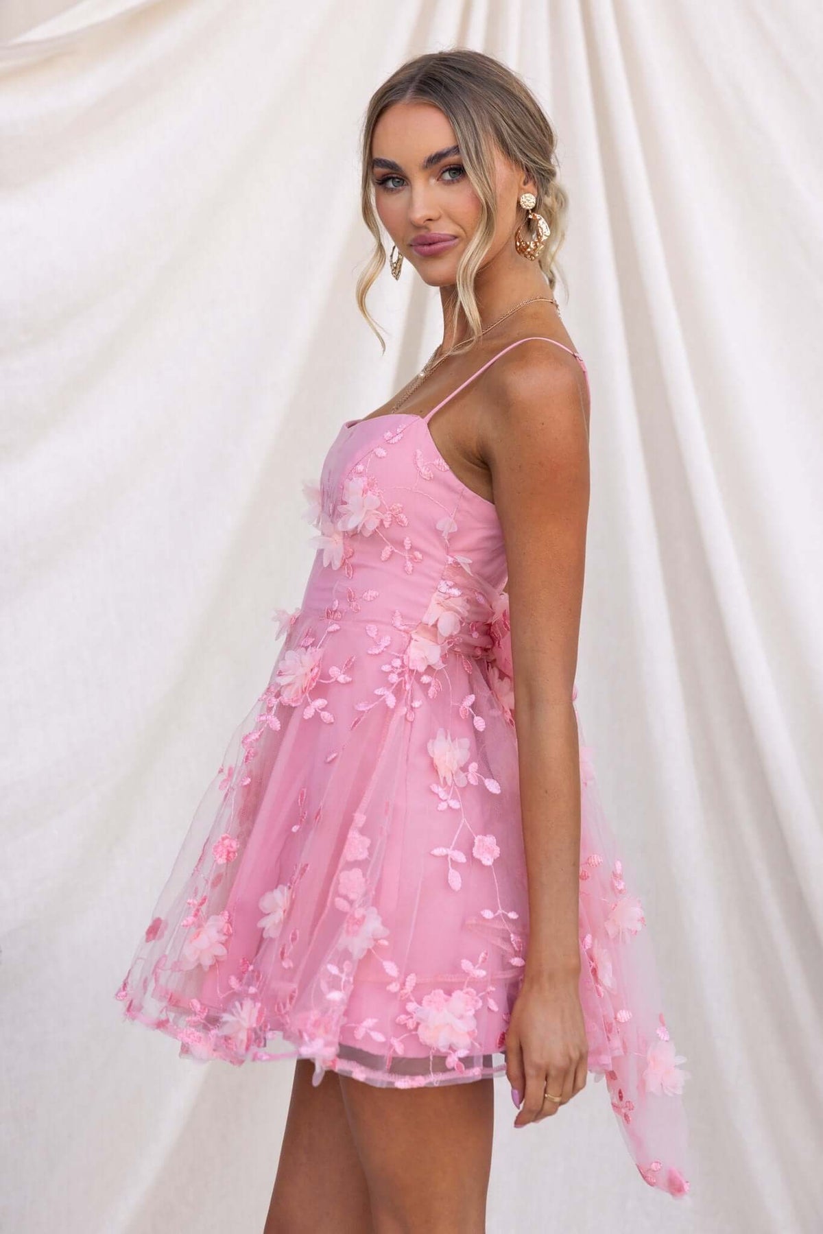 Pink floral lace dress with adjustable straps and boning, featuring a flared tulle skirt, perfect for summer events.