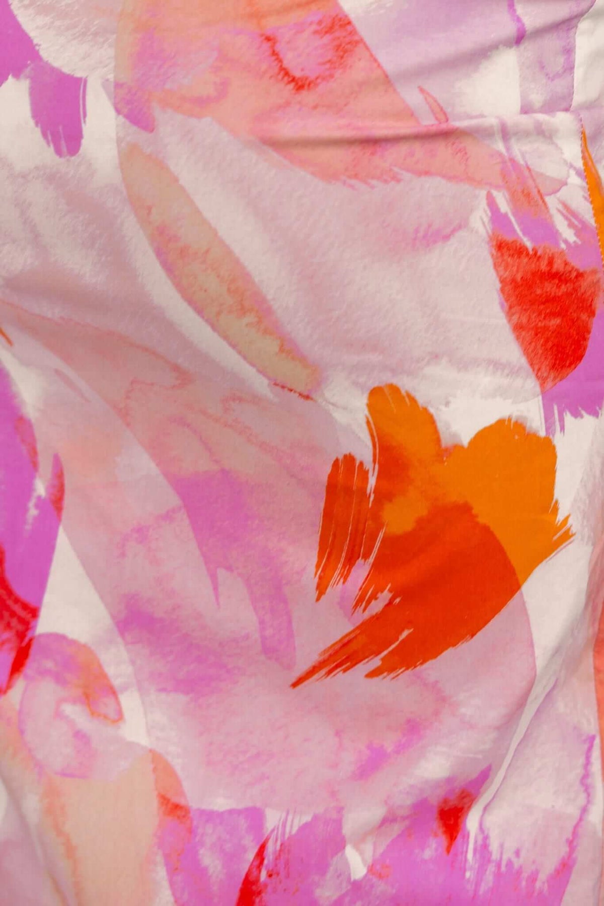 Colorful abstract floral pattern in shades of pink, orange, and red on lightweight fabric for Annerly Maxi Dress.