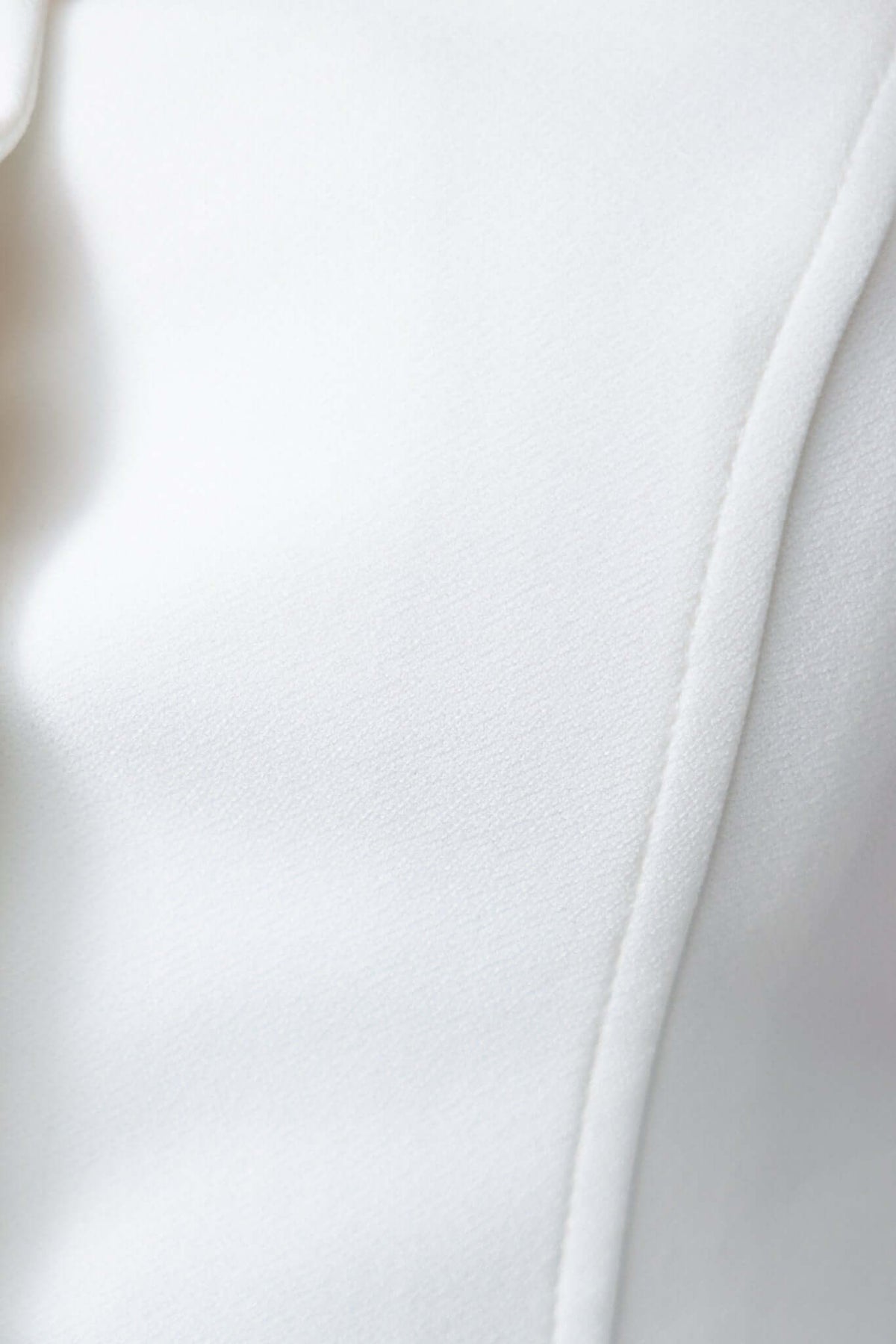 Close-up of Qlair Top in crepe fabric, showcasing its smooth texture and elegant design.