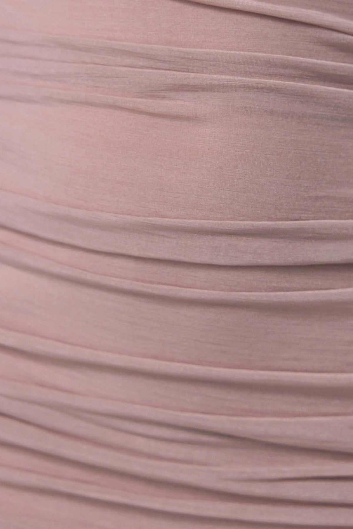 Close-up of soft, ruched chiffon fabric in light pink, showcasing texture and elegant draping for Gellis Midi Dress.