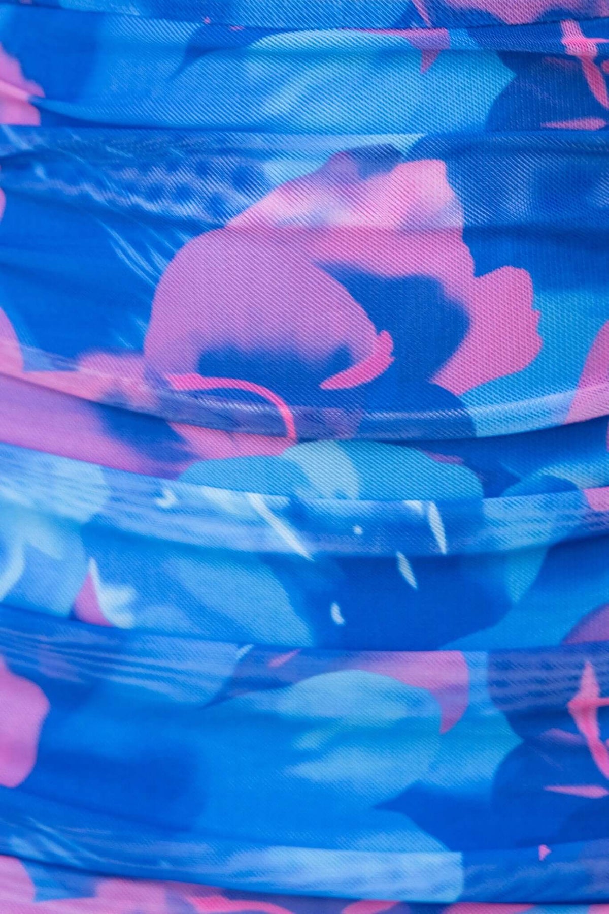 Sundara Maxi Dress close-up featuring vibrant blue and pink floral mesh overlay fabric.