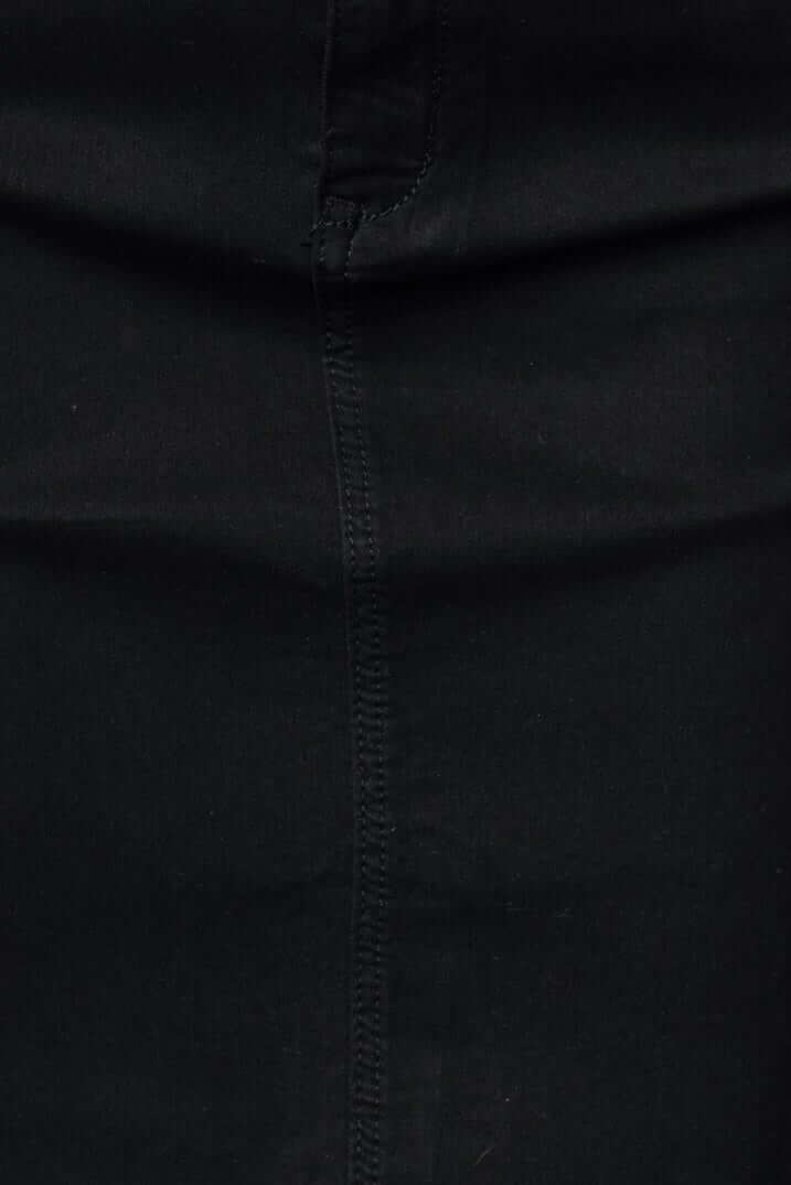 Close-up view of a black denim skirt showcasing the fabric texture and stitching details.