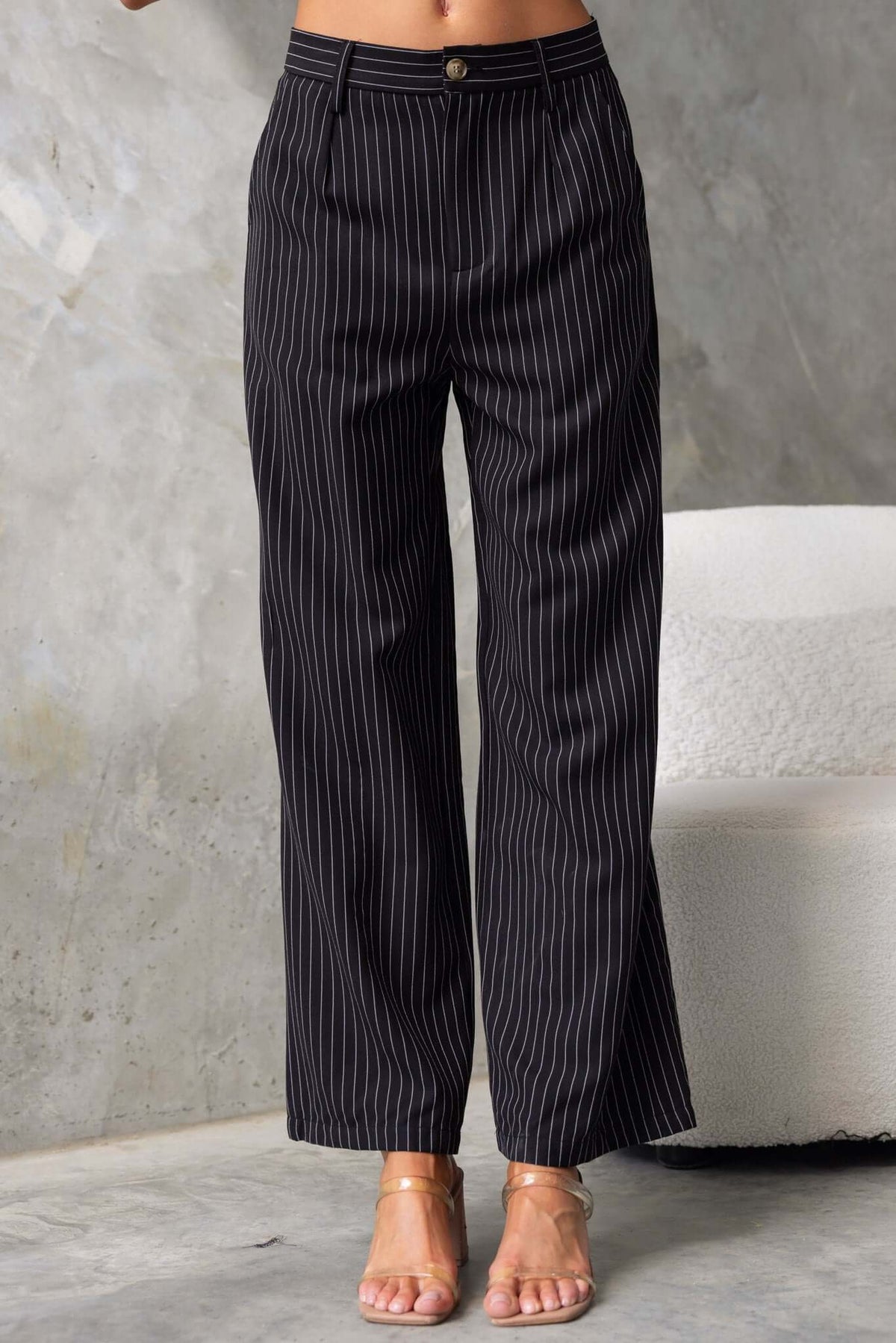 Black striped mid-high waist pants with pockets, perfect for summer casual wear.
