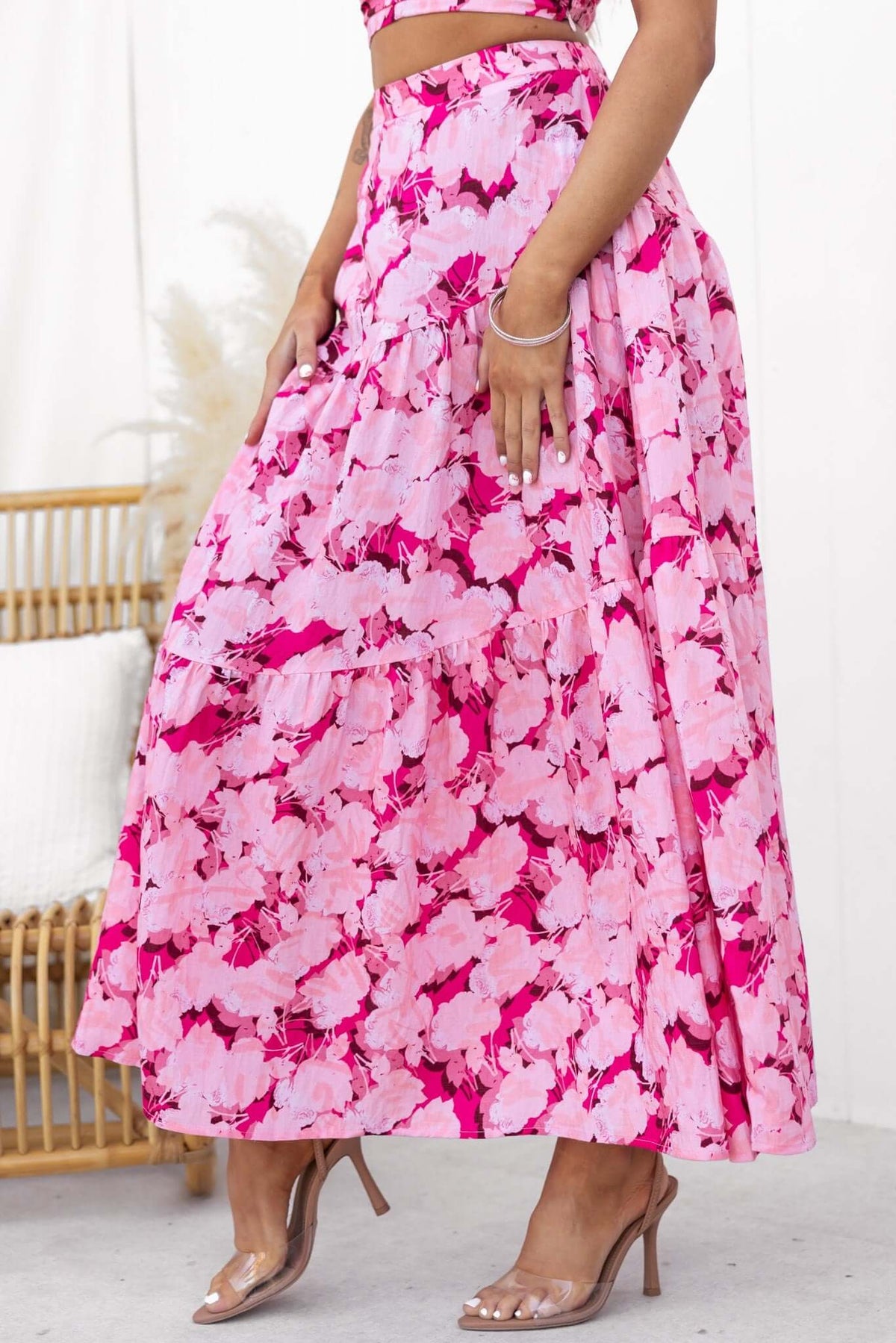 Peachy Days Maxi Skirt in pink floral pattern, featuring an elastic waistband and flowy design, perfect for summer outings.