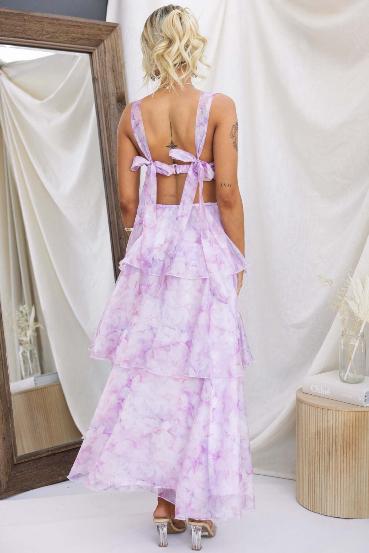 Bennett Ave Maxi Dress in light purple with tiered frills and tie straps, showcasing a stylish back design.