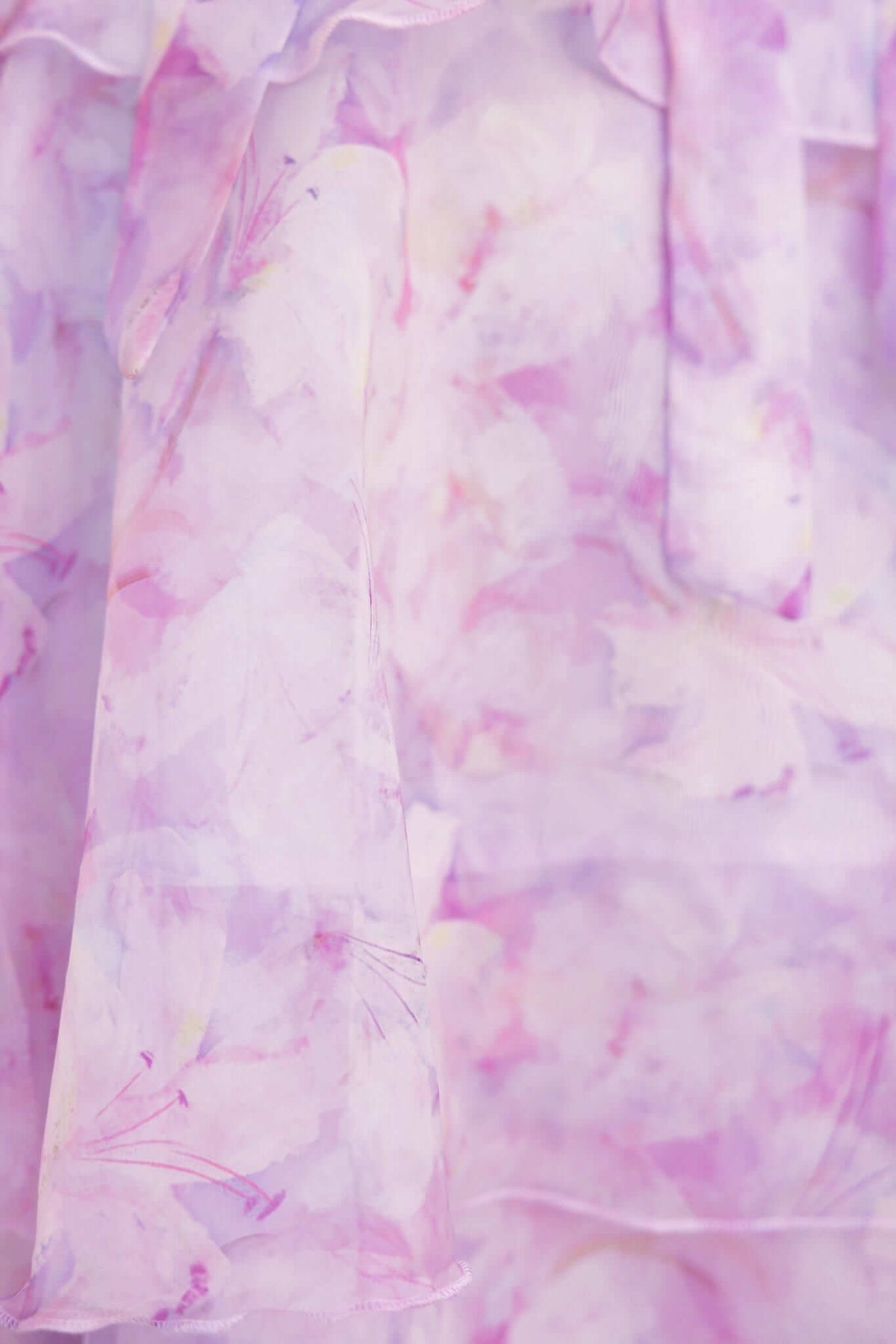 Close-up of lightweight pink floral fabric, perfect for the Bennett Ave Maxi Dress with tiered frills.