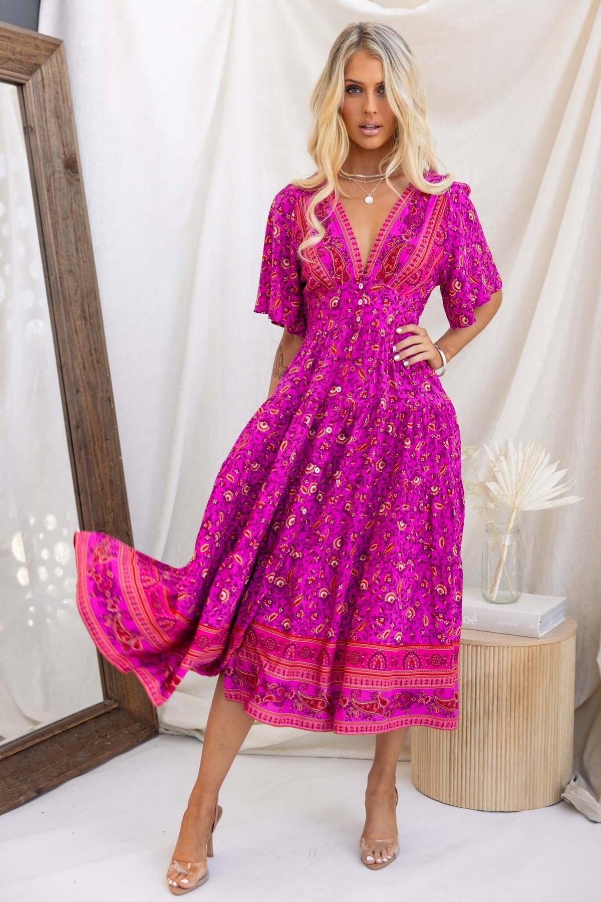 Hope filled Midi Dress in vibrant pink floral design, featuring a button-down front and shirred back, perfect for summer outings.